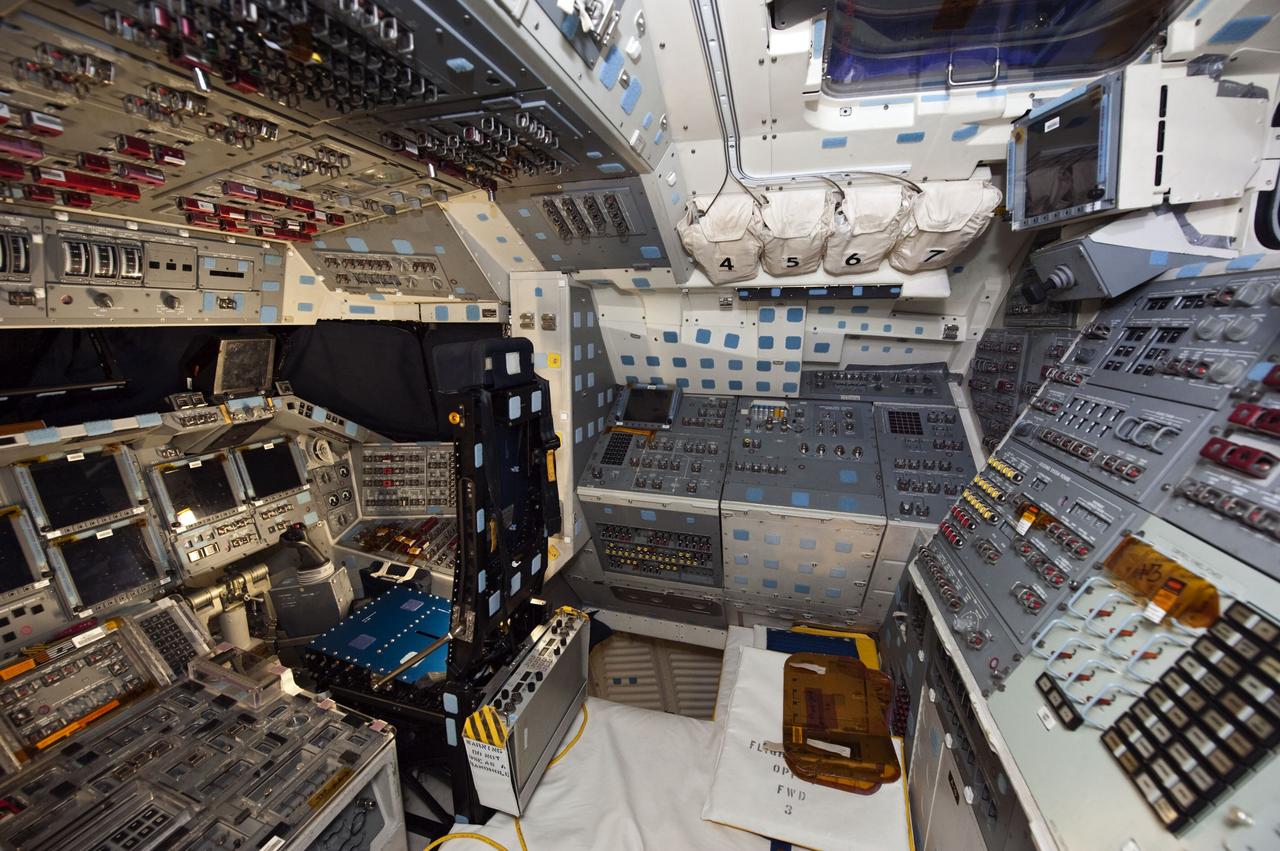 CAPE CANAVERAL, Fla. -- In Orbiter Processing Facility-1 at NASA's Kennedy Space Center in Florida, workers are disconnecting and dismantling components on shuttle Endeavour's cockpit. The work is part of Endeavour's transition and retirement processing. The spacecraft is being prepared for public display at the California Science Center in Los Angeles. Endeavour flew 25 missions, spent 299 days in space, orbited Earth 4,671 times and traveled 122,883,151 miles over the course of its 19-year career. Endeavour's STS-134 and final mission was completed after landing on June 1, 2011. Photo credit: NASA/Kim Shiflett
