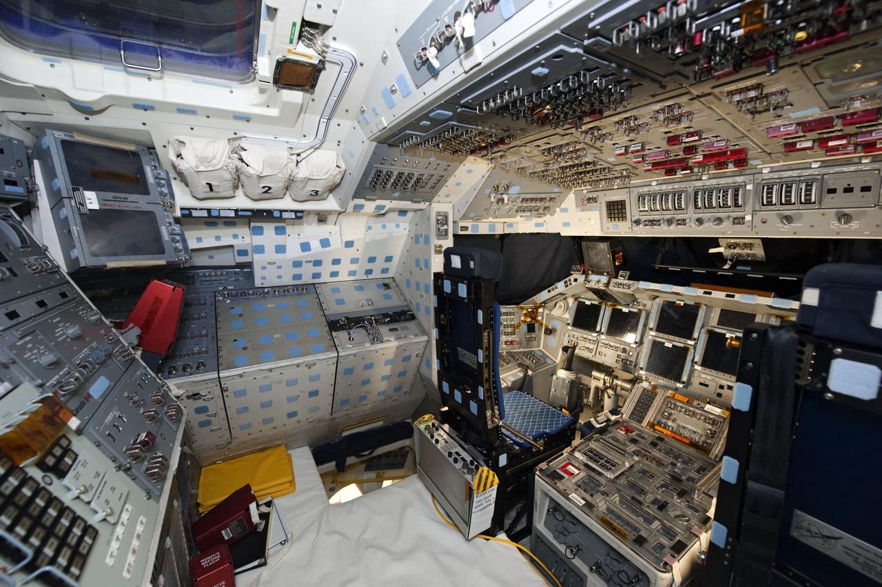 CAPE CANAVERAL, Fla. -- In Orbiter Processing Facility-1 at NASA's Kennedy Space Center in Florida, workers are disconnecting and dismantling components on shuttle Endeavour's cockpit. The work is part of Endeavour's transition and retirement processing. The spacecraft is being prepared for public display at the California Science Center in Los Angeles. Endeavour flew 25 missions, spent 299 days in space, orbited Earth 4,671 times and traveled 122,883,151 miles over the course of its 19-year career. Endeavour's STS-134 and final mission was completed after landing on June 1, 2011. Photo credit: NASA/Kim Shiflett