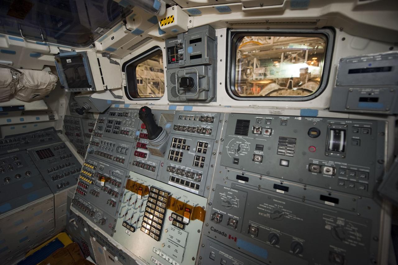 CAPE CANAVERAL, Fla. -- In Orbiter Processing Facility-1 at NASA's Kennedy Space Center in Florida, workers are disconnecting and dismantling components on shuttle Endeavour's cockpit. The work is part of Endeavour's transition and retirement processing. The spacecraft is being prepared for public display at the California Science Center in Los Angeles. Endeavour flew 25 missions, spent 299 days in space, orbited Earth 4,671 times and traveled 122,883,151 miles over the course of its 19-year career. Endeavour's STS-134 and final mission was completed after landing on June 1, 2011. Photo credit: NASA/Kim Shiflett
