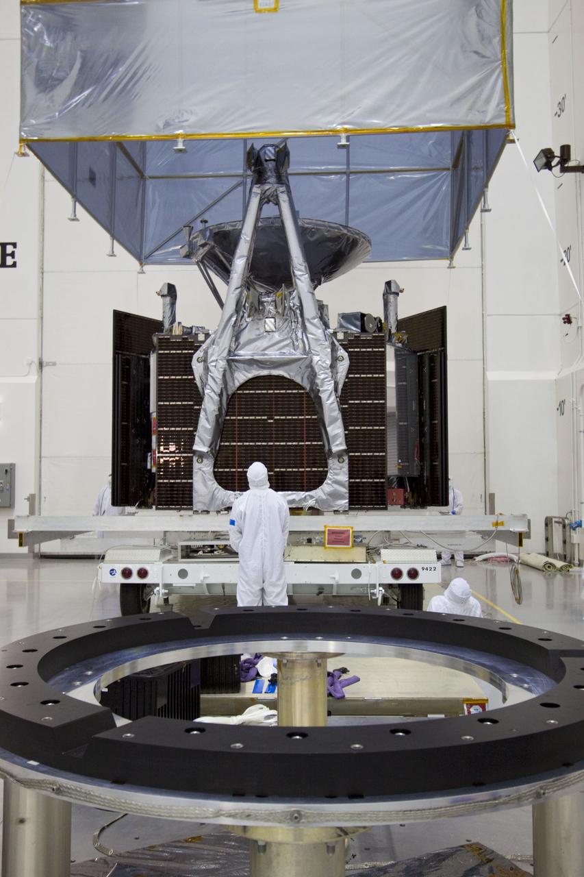 CAPE CANAVERAL, Fla. --  At Astrotech's Hazardous Processing Facility in Titusville, Fla.,  technicians use an overhead crane to lift the cover from NASA's Juno spacecraft before its move to a fueling stand where the spacecraft will be loaded with the propellant necessary for orbit maneuvers and the attitude control system.          Juno is scheduled to launch aboard a United Launch Alliance Atlas V rocket from Cape Canaveral, Fla.,  Aug. 5.The solar-powered spacecraft will orbit Jupiter's poles 33 times to find out more about the gas giant's origins, structure, atmosphere and magnetosphere and investigate the existence of a solid planetary core. For more information visit: www.nasa.gov/juno. Photo credit: NASA/Troy Cryder