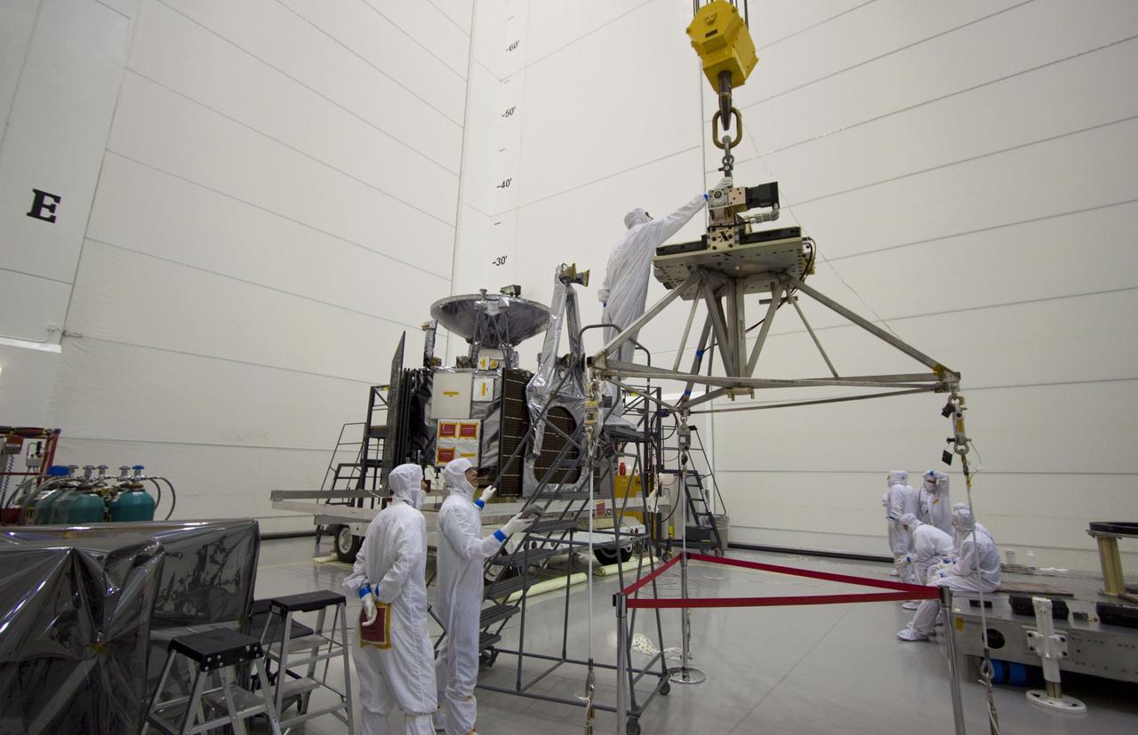 CAPE CANAVERAL, Fla. --  At Astrotech's Hazardous Processing Facility in Titusville, Fla.,  technicians prepare an overhead crane to move NASA's Juno spacecraft to a fueling stand where the spacecraft will be loaded with the propellant necessary for orbit maneuvers and the attitude control system.    Juno is scheduled to launch aboard a United Launch Alliance Atlas V rocket from Cape Canaveral, Fla.,  Aug. 5.The solar-powered spacecraft will orbit Jupiter's poles 33 times to find out more about the gas giant's origins, structure, atmosphere and magnetosphere and investigate the existence of a solid planetary core. For more information visit: www.nasa.gov/juno. Photo credit: NASA/Troy Cryder