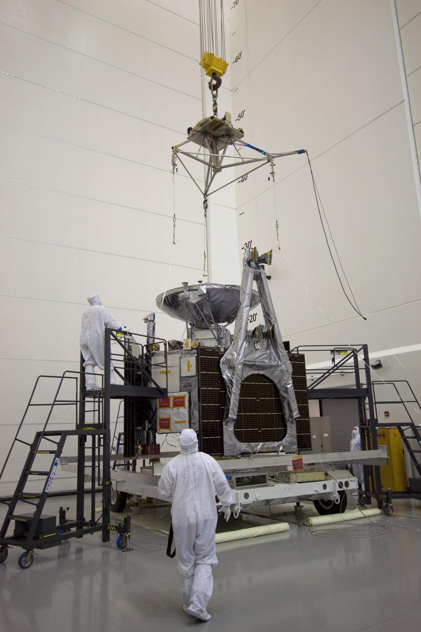 CAPE CANAVERAL, Fla. --  At Astrotech's Hazardous Processing Facility in Titusville, Fla.,  technicians attach an overhead crane to NASA's Juno spacecraft for its move to a fueling stand where the spacecraft will be loaded with the propellant necessary for orbit maneuvers and the attitude control system.            Juno is scheduled to launch aboard a United Launch Alliance Atlas V rocket from Cape Canaveral, Fla.,  Aug. 5.The solar-powered spacecraft will orbit Jupiter's poles 33 times to find out more about the gas giant's origins, structure, atmosphere and magnetosphere and investigate the existence of a solid planetary core. For more information visit: www.nasa.gov/juno. Photo credit: NASA/Troy Cryder