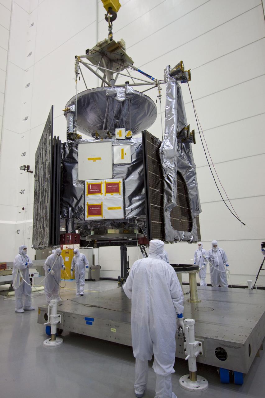 CAPE CANAVERAL, Fla. --  At Astrotech's Hazardous Processing Facility in Titusville, Fla.,  technicians using an overhead crane lower NASA's Juno spacecraft to a fueling stand where the spacecraft will be loaded with the propellant necessary for orbit maneuvers and the attitude control system.          Juno is scheduled to launch aboard a United Launch Alliance Atlas V rocket from Cape Canaveral, Fla.,  Aug. 5.The solar-powered spacecraft will orbit Jupiter's poles 33 times to find out more about the gas giant's origins, structure, atmosphere and magnetosphere and investigate the existence of a solid planetary core. For more information visit: www.nasa.gov/juno. Photo credit: NASA/Troy Cryder