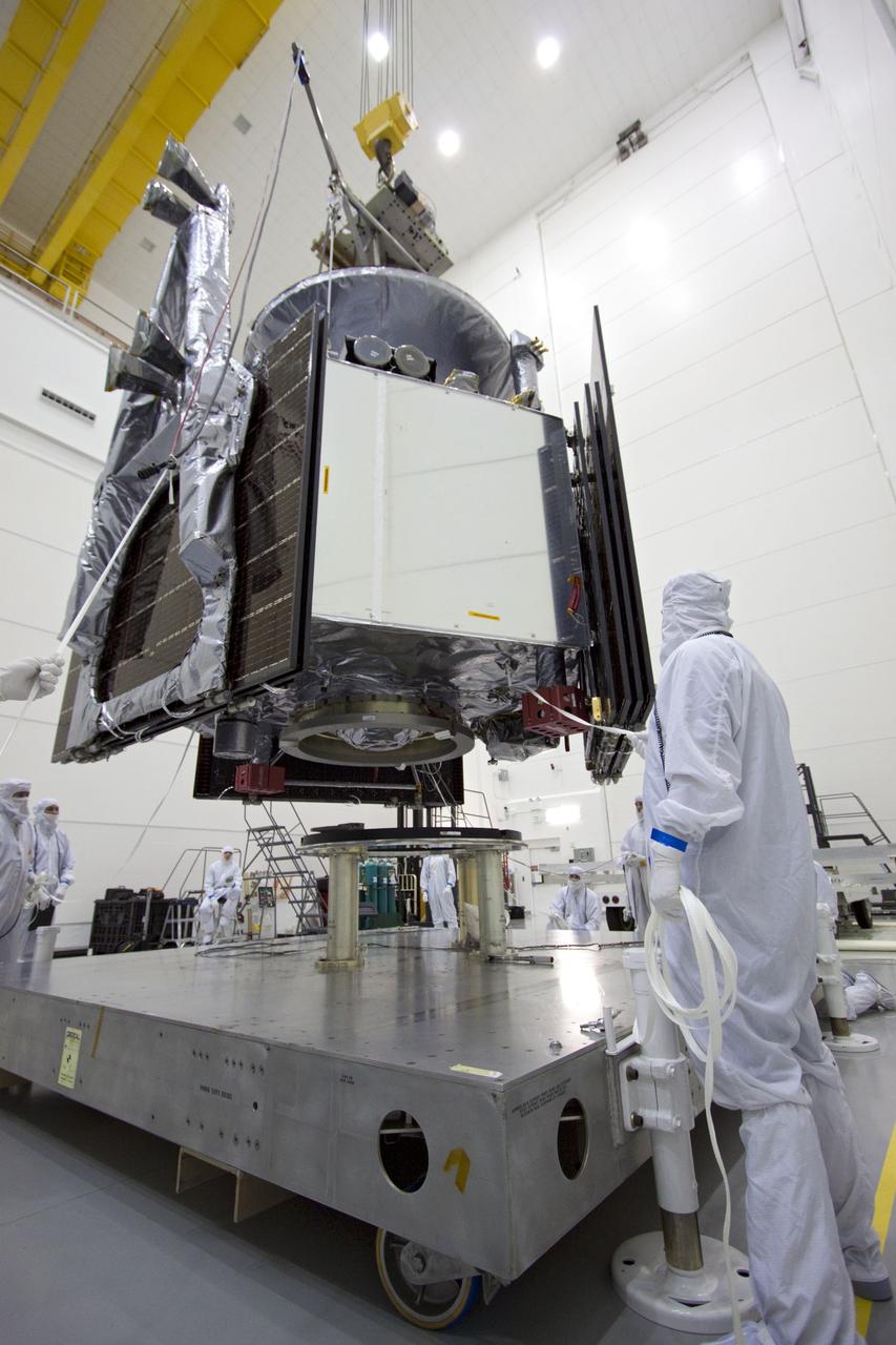 CAPE CANAVERAL, Fla. --  At Astrotech's Hazardous Processing Facility in Titusville, Fla.,  technicians using an overhead crane lower NASA's Juno spacecraft to a fueling stand where the spacecraft will be loaded with the propellant necessary for orbit maneuvers and the attitude control system.          Juno is scheduled to launch aboard a United Launch Alliance Atlas V rocket from Cape Canaveral, Fla.,  Aug. 5.The solar-powered spacecraft will orbit Jupiter's poles 33 times to find out more about the gas giant's origins, structure, atmosphere and magnetosphere and investigate the existence of a solid planetary core. For more information visit: www.nasa.gov/juno. Photo credit: NASA/Troy Cryder