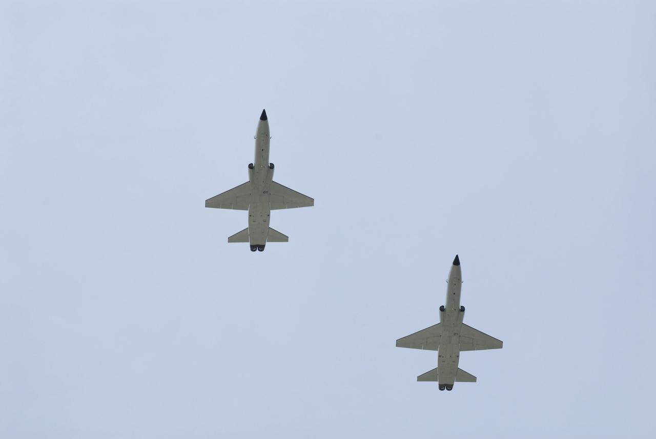 CAPE CANAVERAL, Fla. -- High above NASA's Kennedy Space Center in Florida, the STS-135 crew members get ready to land their T-38 jets at the Shuttle Landing Facility. The STS-135 astronauts arrived at Kennedy at about 2:30 p.m. EDT on July 4 for final preparations for space shuttle Atlantis' STS-135 mission to the International Space Station. Atlantis is scheduled to lift off on July 8 to deliver the Raffaello multi-purpose logistics module packed with supplies and spare parts to the station. The STS-135 mission also will fly a system to investigate the potential for robotically refueling existing satellites and return a failed ammonia pump module to help NASA better understand the failure mechanism and improve pump designs for future systems. STS-135 will be the 33rd flight of Atlantis, the 37th shuttle mission to the space station, and the 135th and final mission of NASA's Space Shuttle Program. For more information visit, www.nasa.gov/mission_pages/shuttle/shuttlemissions/sts135/index.html. Photo credit: NASA/Kim Shiflett