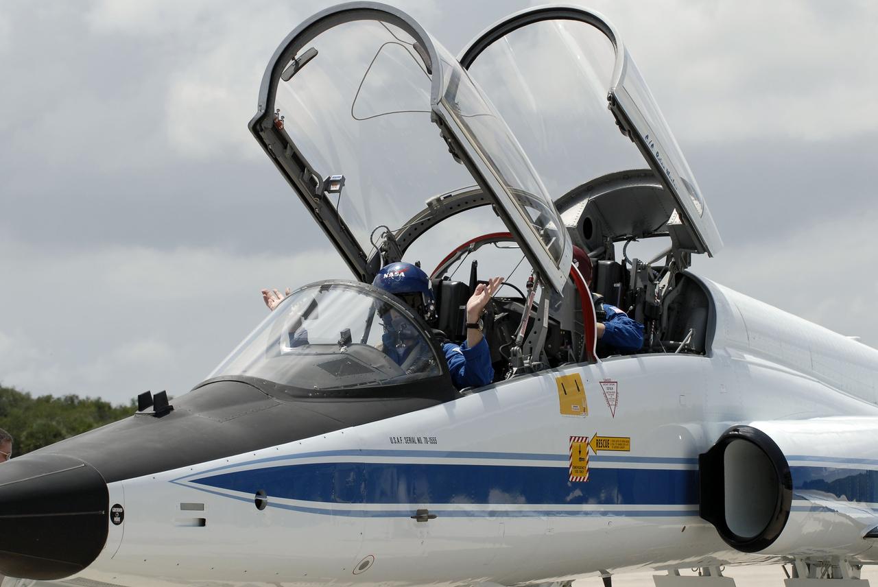 CAPE CANAVERAL, Fla. -- On the Shuttle Landing Facility at NASA's Kennedy Space Center in Florida, STS-135 Commander Chris Ferguson and Mission Specialist Sandy Magnus are ready to disembark from a T-38 jet. The STS-135 astronauts arrived at Kennedy about 2:30 p.m. EDT on July 4 for final preparations for space shuttle Atlantis' STS-135 mission to the International Space Station. Atlantis is scheduled to lift off on July 8 to deliver the Raffaello multi-purpose logistics module packed with supplies and spare parts to the station. The STS-135 mission also will fly a system to investigate the potential for robotically refueling existing satellites and return a failed ammonia pump module to help NASA better understand the failure mechanism and improve pump designs for future systems. STS-135 will be the 33rd flight of Atlantis, the 37th shuttle mission to the space station, and the 135th and final mission of NASA's Space Shuttle Program. For more information visit, www.nasa.gov/mission_pages/shuttle/shuttlemissions/sts135/index.html. Photo credit: NASA/Kim Shiflett