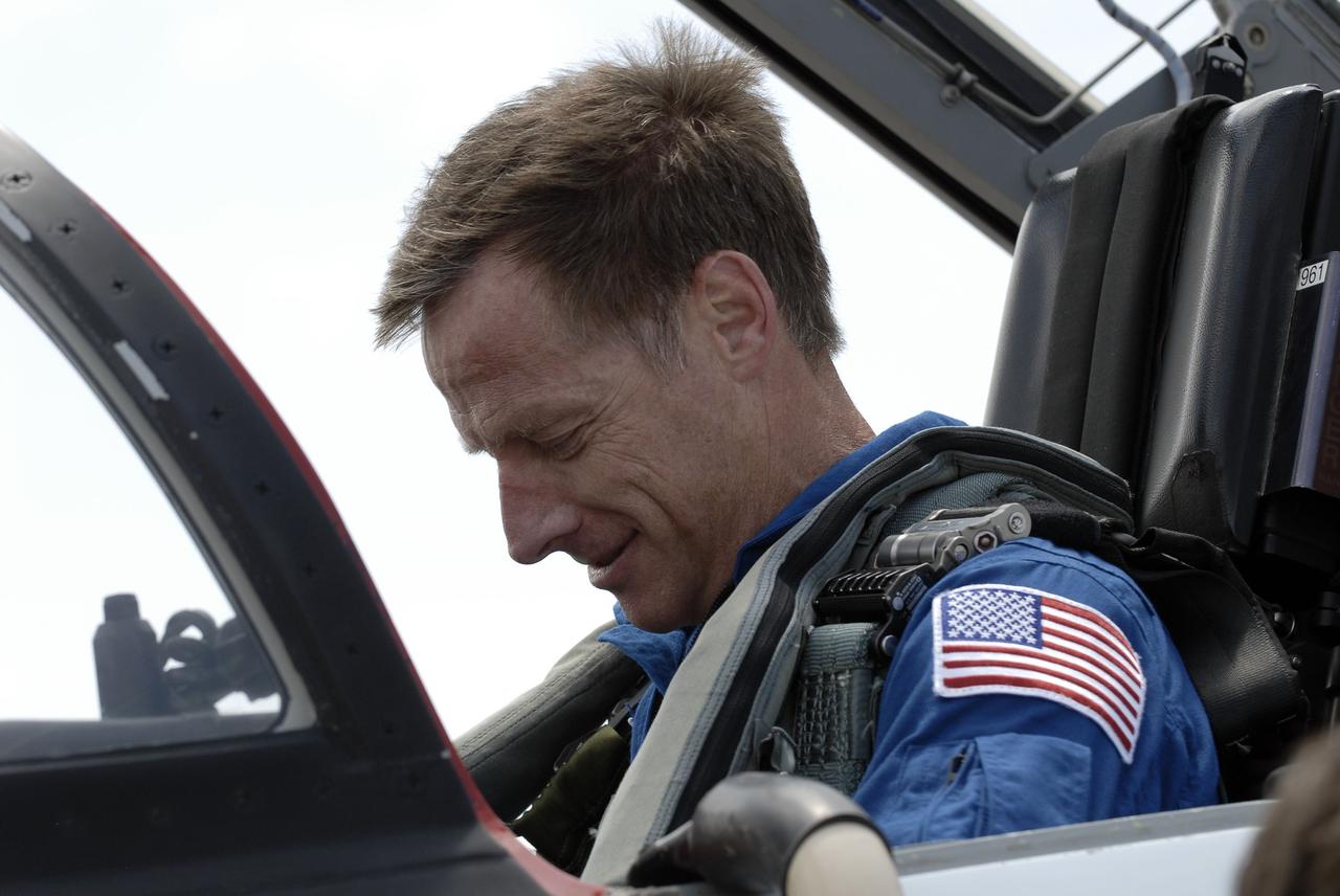 CAPE CANAVERAL, Fla. -- On the Shuttle Landing Facility at NASA's Kennedy Space Center in Florida, STS-135 Commander Chris Ferguson prepares to disembark from a T-38 jet.          The STS-135 astronauts arrived at Kennedy about 2:30 p.m. EDT on July 4 for final preparations for space shuttle Atlantis' STS-135 mission to the International Space Station. Atlantis is scheduled to lift off on July 8 to deliver the Raffaello multi-purpose logistics module packed with supplies and spare parts to the station. The STS-135 mission also will fly a system to investigate the potential for robotically refueling existing satellites and return a failed ammonia pump module to help NASA better understand the failure mechanism and improve pump designs for future systems. STS-135 will be the 33rd flight of Atlantis, the 37th shuttle mission to the space station, and the 135th and final mission of NASA's Space Shuttle Program. For more information visit, www.nasa.gov/mission_pages/shuttle/shuttlemissions/sts135/index.html. Photo credit: NASA/Kim Shiflett
