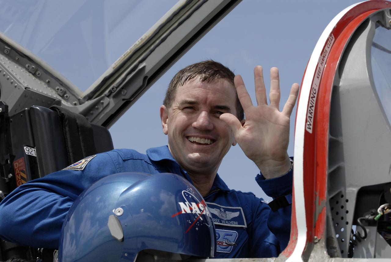 CAPE CANAVERAL, Fla. -- On the Shuttle Landing Facility at NASA's Kennedy Space Center in Florida, STS-135 Mission Specialist Rex Walheim prepares to disembark from a T-38 jet. The STS-135 astronauts arrived at Kennedy about 2:30 p.m. EDT on July 4 for final preparations for space shuttle Atlantis' STS-135 mission to the International Space Station. Atlantis is scheduled to lift off on July 8 to deliver the Raffaello multi-purpose logistics module packed with supplies and spare parts to the station. The STS-135 mission also will fly a system to investigate the potential for robotically refueling existing satellites and return a failed ammonia pump module to help NASA better understand the failure mechanism and improve pump designs for future systems. STS-135 will be the 33rd flight of Atlantis, the 37th shuttle mission to the space station, and the 135th and final mission of NASA's Space Shuttle Program. For more information visit, www.nasa.gov/mission_pages/shuttle/shuttlemissions/sts135/index.html. Photo credit: NASA/Kim Shiflett