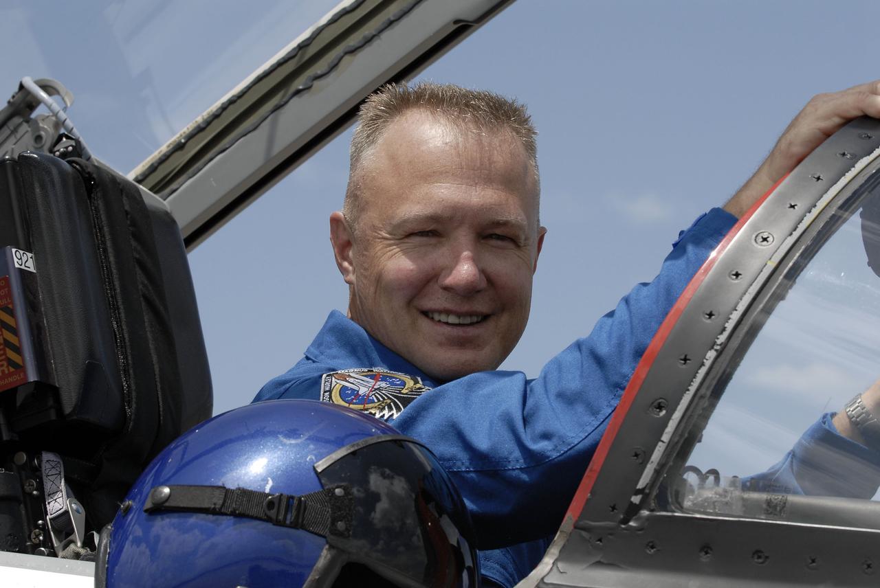 CAPE CANAVERAL, Fla. -- On the Shuttle Landing Facility at NASA's Kennedy Space Center in Florida, STS-135 Pilot Doug Hurley prepares to disembark from a T-38 jet. The STS-135 astronauts arrived at Kennedy about 2:30 p.m. EDT on July 4 for final preparations for space shuttle Atlantis' STS-135 mission to the International Space Station. Atlantis is scheduled to lift off on July 8 to deliver the Raffaello multi-purpose logistics module packed with supplies and spare parts to the station. The STS-135 mission also will fly a system to investigate the potential for robotically refueling existing satellites and return a failed ammonia pump module to help NASA better understand the failure mechanism and improve pump designs for future systems. STS-135 will be the 33rd flight of Atlantis, the 37th shuttle mission to the space station, and the 135th and final mission of NASA's Space Shuttle Program. For more information visit, www.nasa.gov/mission_pages/shuttle/shuttlemissions/sts135/index.html. Photo credit: NASA/Kim Shiflett