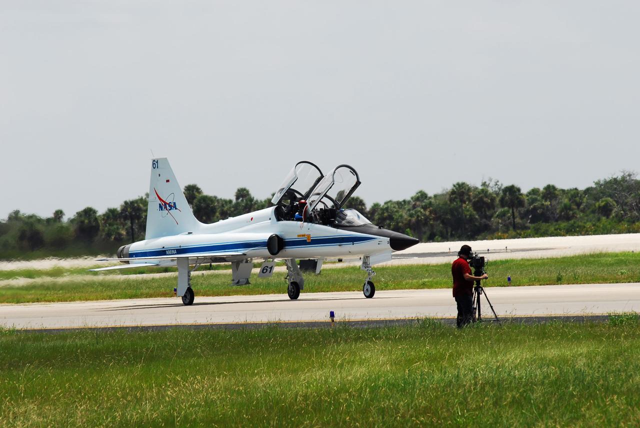CAPE CANAVERAL, Fla. -- STS-135 Commander Chris Ferguson and Mission Specialist Sandy Magnus have touched down in a T-38 jet on the Shuttle Landing Facility at NASA's Kennedy Space Center in Florida. The STS-135 astronauts arrived at Kennedy about 2:30 p.m. EDT on July 4 for final preparations for space shuttle Atlantis' STS-135 mission to the International Space Station. Atlantis is scheduled to lift off on July 8 to deliver the Raffaello multi-purpose logistics module packed with supplies and spare parts to the station. The STS-135 mission also will fly a system to investigate the potential for robotically refueling existing satellites and return a failed ammonia pump module to help NASA better understand the failure mechanism and improve pump designs for future systems. STS-135 will be the 33rd flight of Atlantis, the 37th shuttle mission to the space station, and the 135th and final mission of NASA's Space Shuttle Program. For more information visit, www.nasa.gov/mission_pages/shuttle/shuttlemissions/sts135/index.html. Photo credit: NASA/Jim Grossmann
