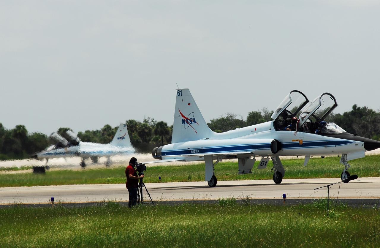 CAPE CANAVERAL, Fla. -- STS-135 Commander Chris Ferguson and Mission Specialist Sandy Magnus have touched down in a T-38 jet on the Shuttle Landing Facility at NASA's Kennedy Space Center in Florida, closely followed by Pilot Doug Hurley and Mission Specialist Rex Walheim.      The STS-135 astronauts arrived at Kennedy about 2:30 p.m. EDT on July 4 for final preparations for space shuttle Atlantis' STS-135 mission to the International Space Station. Atlantis is scheduled to lift off on July 8 to deliver the Raffaello multi-purpose logistics module packed with supplies and spare parts to the station. The STS-135 mission also will fly a system to investigate the potential for robotically refueling existing satellites and return a failed ammonia pump module to help NASA better understand the failure mechanism and improve pump designs for future systems. STS-135 will be the 33rd flight of Atlantis, the 37th shuttle mission to the space station, and the 135th and final mission of NASA's Space Shuttle Program. For more information visit, www.nasa.gov/mission_pages/shuttle/shuttlemissions/sts135/index.html. Photo credit: NASA/Jim Grossmann