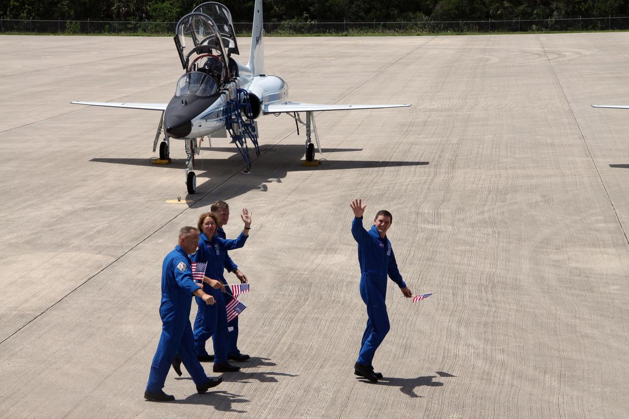 CAPE CANAVERAL, Fla. -- The STS-135 crew depart the Shuttle Landing Facility at NASA's Kennedy Space Center in Florida for the Astronaut Crew Quarters in Kennedy's Operations and Checkout Building. From left are Pilot Doug Hurley, Mission Specialist Sandy Magnus, Commander Chris Ferguson and Mission Specialist Rex Walheim. The STS-135 astronauts arrived at Kennedy about 2:30 p.m. EDT on July 4 for final preparations for space shuttle Atlantis' STS-135 mission to the International Space Station. Atlantis is scheduled to lift off on July 8 to deliver the Raffaello multi-purpose logistics module packed with supplies and spare parts to the station. The STS-135 mission also will fly a system to investigate the potential for robotically refueling existing satellites and return a failed ammonia pump module to help NASA better understand the failure mechanism and improve pump designs for future systems. STS-135 will be the 33rd flight of Atlantis, the 37th shuttle mission to the space station, and the 135th and final mission of NASA's Space Shuttle Program. For more information visit, www.nasa.gov/mission_pages/shuttle/shuttlemissions/sts135/index.html. Photo credit: NASA/Ken Thornsley