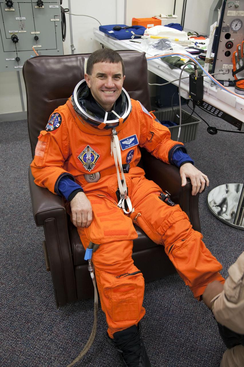 CAPE CANAVERAL, Fla. -- In the Operations and Checkout Building at NASA's Kennedy Space Center in Florida, STS-135 Mission Specialist Rex Walheim has his launch-and-landing suit checked by a suit technician, part of final preparations for space shuttle Atlantis' STS-135 mission to the International Space Station. Atlantis and its crew are scheduled to lift off at 11:26 a.m. EDT on July 8 to deliver the Raffaello multi-purpose logistics module packed with supplies and spare parts to the station. The STS-135 mission also will fly a system to investigate the potential for robotically refueling existing satellites and return a failed ammonia pump module to help NASA better understand the failure mechanism and improve pump designs for future systems. STS-135 will be the 33rd flight of Atlantis, the 37th shuttle mission to the space station, and the 135th and final mission of NASA's Space Shuttle Program. For more information visit, www.nasa.gov/mission_pages/shuttle/shuttlemissions/sts135/index.html. Photo credit: NASA/Cory Huston