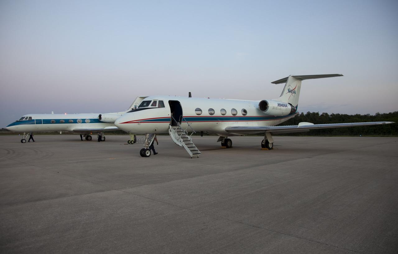 CAPE CANAVERAL, Fla. -- STS-135 Commander Chris Ferguson and Pilot Doug Hurley return after performing touch-and-go landings aboard a Shuttle Training Aircraft (STA) on the Shuttle Landing Facility runway at NASA's Kennedy Space Center in Florida. An STA is a Gulfstream II jet that is modified to mimic the shuttle's handling during the final phase of landing. Ferguson and Hurley practice landings as part of standard procedure before space shuttle Atlantis' launch to the International Space Station. Atlantis and its crew are scheduled to lift off at 11:26 a.m. EDT on July 8 to deliver the Raffaello multi-purpose logistics module packed with supplies and spare parts to the station. The STS-135 mission also will fly a system to investigate the potential for robotically refueling existing satellites and return a failed ammonia pump module to help NASA better understand the failure mechanism and improve pump designs for future systems. STS-135 will be the 33rd flight of Atlantis, the 37th shuttle mission to the space station, and the 135th and final mission of NASA's Space Shuttle Program. For more information visit, www.nasa.gov/mission_pages/shuttle/shuttlemissions/sts135/index.html. Photo credit: NASA/Cory Huston