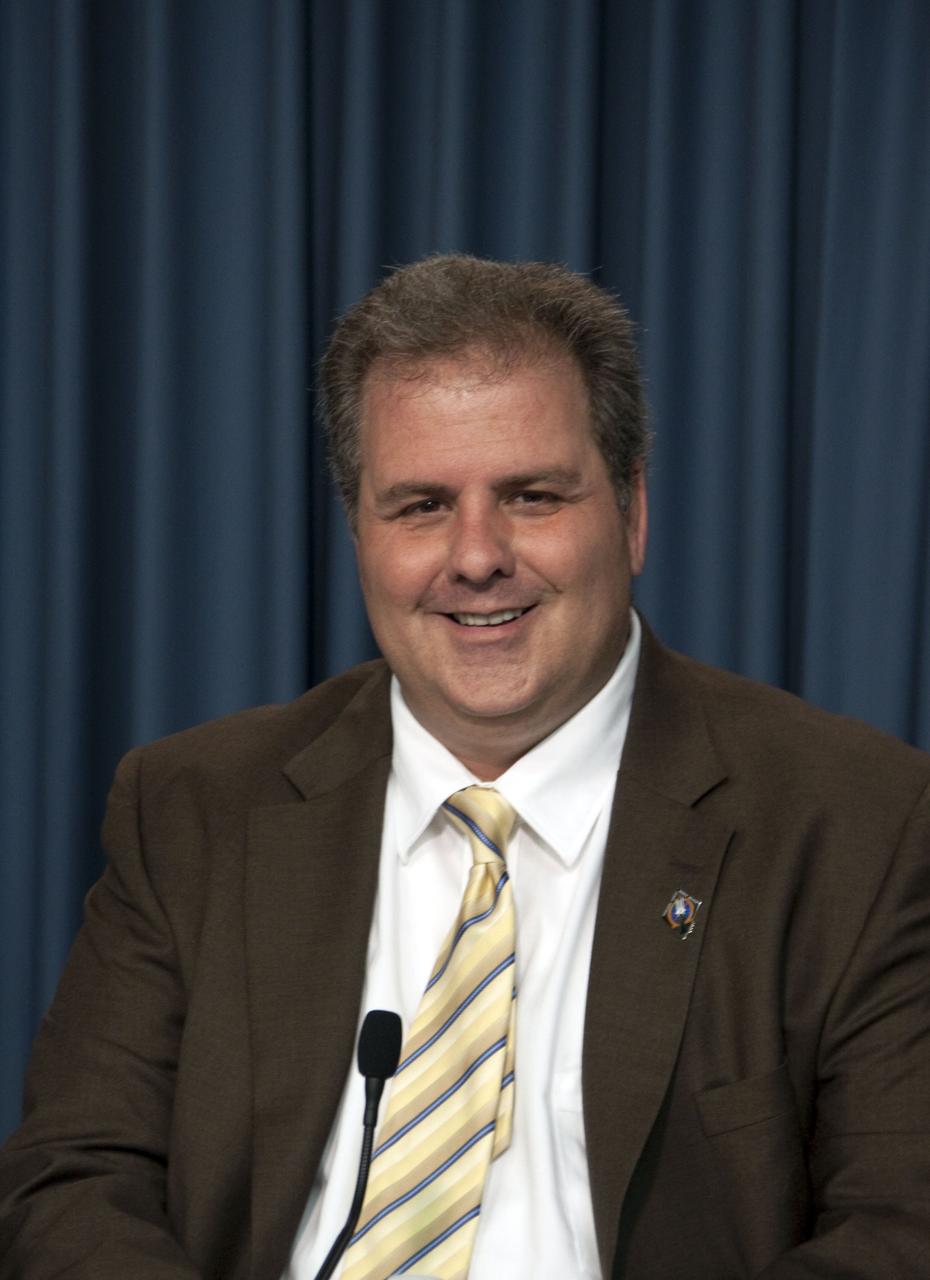CAPE CANAVERAL, Fla. -- In the Press Site auditorium at NASA's Kennedy Space Center in Florida, NASA managers brief media about the payload and launch status of space shuttle Atlantis' STS-135 mission to the International Space Station. Seen here is Payload Mission Manager Joe Delai. Atlantis and its crew are scheduled to lift off at 11:26 a.m. EDT on July 8 to deliver the Raffaello multi-purpose logistics module packed with supplies and spare parts to the station. The STS-135 mission also will fly a system to investigate the potential for robotically refueling existing satellites and return a failed ammonia pump module to help NASA better understand the failure mechanism and improve pump designs for future systems. STS-135 will be the 33rd flight of Atlantis, the 37th shuttle mission to the space station, and the 135th and final mission of NASA's Space Shuttle Program. For more information visit, www.nasa.gov/mission_pages/shuttle/shuttlemissions/sts135/index.html. Photo credit: NASA/Jim Grossmann