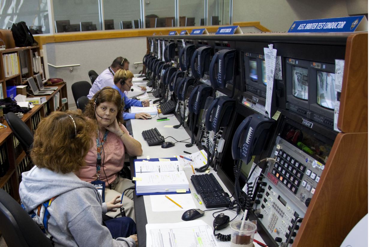 CAPE CANAVERAL, Fla. -- In Firing Room 4 in the Launch Control Center at NASA's Kennedy Space Center in Florida, launch team members sit at their consoles preparing for space shuttle Atlantis' STS-135 mission to the International Space Station. Atlantis and its crew of four are scheduled to lift off at 11:26 a.m. EDT on July 8 to deliver the Raffaello multi-purpose logistics module packed with supplies and spare parts to the station. The STS-135 mission also will fly a system to investigate the potential for robotically refueling existing satellites and return a failed ammonia pump module to help NASA better understand the failure mechanism and improve pump designs for future systems. STS-135 will be the 33rd flight of Atlantis, the 37th shuttle mission to the space station, and the 135th and final mission of NASA's Space Shuttle Program. For more information visit, www.nasa.gov/mission_pages/shuttle/shuttlemissions/sts135/index.html. Photo credit: NASA/Frankie Martin