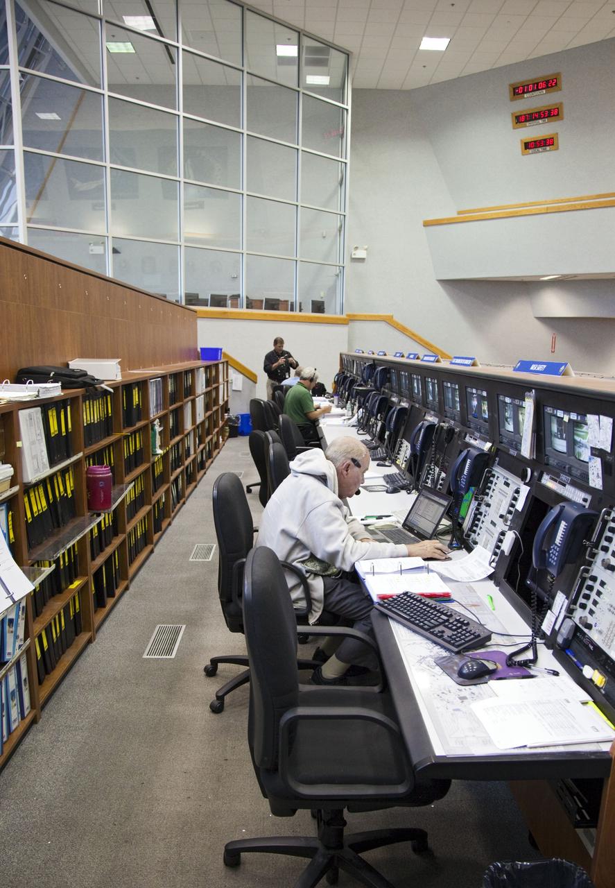 CAPE CANAVERAL, Fla. -- In Firing Room 4 in the Launch Control Center at NASA's Kennedy Space Center in Florida, launch team members sit at their consoles preparing for space shuttle Atlantis' STS-135 mission to the International Space Station. Atlantis and its crew of four are scheduled to lift off at 11:26 a.m. EDT on July 8 to deliver the Raffaello multi-purpose logistics module packed with supplies and spare parts to the station. The STS-135 mission also will fly a system to investigate the potential for robotically refueling existing satellites and return a failed ammonia pump module to help NASA better understand the failure mechanism and improve pump designs for future systems. STS-135 will be the 33rd flight of Atlantis, the 37th shuttle mission to the space station, and the 135th and final mission of NASA's Space Shuttle Program. For more information visit, www.nasa.gov/mission_pages/shuttle/shuttlemissions/sts135/index.html. Photo credit: NASA/Frankie Martin