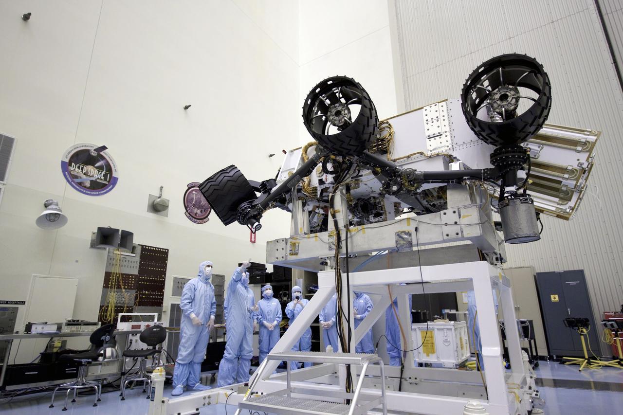 Cape Canaveral, Fla. - At the Payload Hazardous Servicing Facility at NASA's Kennedy Space Center in Florida, John Grotzinger, project scientist for NASA's Mars Science Laboratory (MSL) rover known as Curiosity, points out components of the rover to NASA Deputy Administrator Lori Garver, to his right.     A United Launch Alliance Atlas V-541 configuration will be used to loft MSL into space. Curiosity’s 10 science instruments are designed to search for evidence on whether Mars has had environments favorable to microbial life, including chemical ingredients for life.  The unique rover will use a laser to look inside rocks and release its gasses so that the rover’s spectrometer can analyze and send the data back to Earth. MSL is scheduled to launch from Cape Canaveral Air Force Station in Florida Nov. 25 with a window extending to Dec. 18 and arrival at Mars Aug. 2012. For more information, visit http://www.nasa.gov/msl. Photo credit: NASA/Jim Grossmann