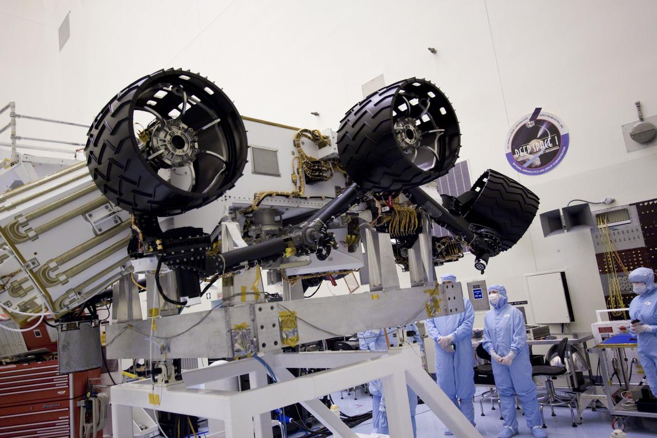 Cape Canaveral, Fla. - NASA Deputy Administrator Lori Garver looks over NASA's Mars Science Laboratory (MSL) rover known as Curiosity as it sits in a workstand at the Payload Hazardous Servicing Facility at NASA's Kennedy Space Center in Florida. A United Launch Alliance Atlas V-541 configuration will be used to loft MSL into space. Curiosity’s 10 science instruments are designed to search for evidence on whether Mars has had environments favorable to microbial life, including chemical ingredients for life. The unique rover will use a laser to look inside rocks and release its gasses so that the rover’s spectrometer can analyze and send the data back to Earth. MSL is scheduled to launch from Cape Canaveral Air Force Station in Florida Nov. 25 with a window extending to Dec. 18 and arrival at Mars Aug. 2012. For more information, visit http://www.nasa.gov/msl. Photo credit: NASA/Jim Grossmann