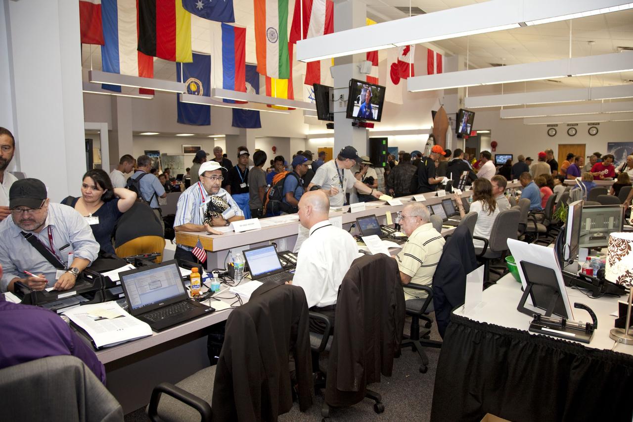 CAPE CANAVERAL, Fla. -- Media from around the globe gather at the Press Site bull pen at NASA's Kennedy Space Center in Florida to cover the prelaunch activities and lift off of space shuttle Atlantis on its STS-135 mission to the International Space Station.         Atlantis and its crew of four; Commander Chris Ferguson, Pilot Doug Hurley and Mission Specialists Sandy Magnus and Rex Walheim, are scheduled to lift off at 11:26 a.m. EDT on July 8 to deliver the Raffaello multi-purpose logistics module packed with supplies and spare parts to the station. Atlantis also will fly the Robotic Refueling Mission experiment that will investigate the potential for robotically refueling existing satellites in orbit. In addition, Atlantis will return with a failed ammonia pump module to help NASA better understand the failure mechanism and improve pump designs for future systems. STS-135 will be the 33rd flight of Atlantis, the 37th shuttle mission to the space station, and the 135th and final mission of NASA's Space Shuttle Program. For more information visit, www.nasa.gov/mission_pages/shuttle/shuttlemissions/sts135/index.html. Photo credit: NASA/Frankie Martin
