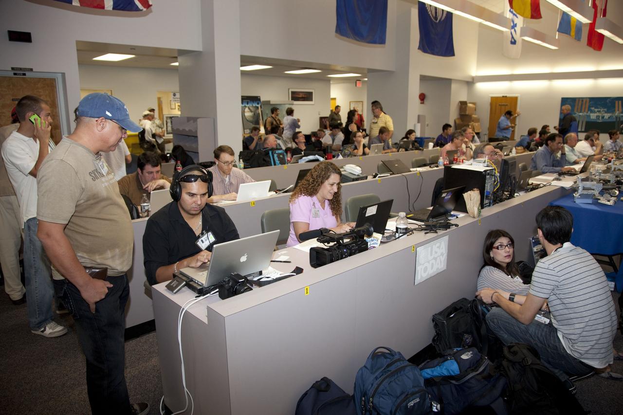 CAPE CANAVERAL, Fla. -- Media from around the globe gather at the Press Site bull pen at NASA's Kennedy Space Center in Florida to cover the prelaunch activities and lift off of space shuttle Atlantis on its STS-135 mission to the International Space Station.         Atlantis and its crew of four; Commander Chris Ferguson, Pilot Doug Hurley and Mission Specialists Sandy Magnus and Rex Walheim, are scheduled to lift off at 11:26 a.m. EDT on July 8 to deliver the Raffaello multi-purpose logistics module packed with supplies and spare parts to the station. Atlantis also will fly the Robotic Refueling Mission experiment that will investigate the potential for robotically refueling existing satellites in orbit. In addition, Atlantis will return with a failed ammonia pump module to help NASA better understand the failure mechanism and improve pump designs for future systems. STS-135 will be the 33rd flight of Atlantis, the 37th shuttle mission to the space station, and the 135th and final mission of NASA's Space Shuttle Program. For more information visit, www.nasa.gov/mission_pages/shuttle/shuttlemissions/sts135/index.html. Photo credit: NASA/Frankie Martin