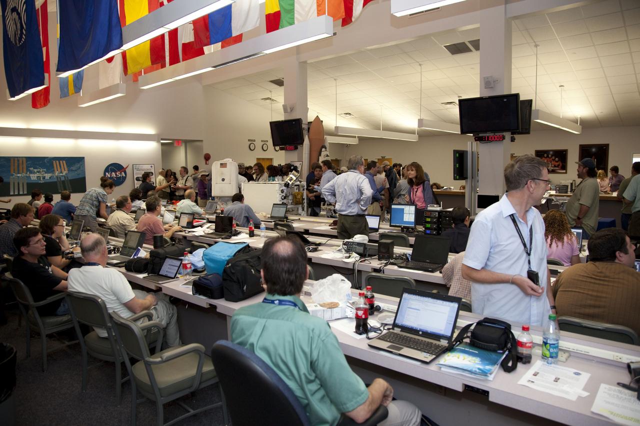 CAPE CANAVERAL, Fla. -- Media from around the globe gather at the Press Site bull pen at NASA's Kennedy Space Center in Florida to cover the prelaunch activities and lift off of space shuttle Atlantis on its STS-135 mission to the International Space Station.         Atlantis and its crew of four; Commander Chris Ferguson, Pilot Doug Hurley and Mission Specialists Sandy Magnus and Rex Walheim, are scheduled to lift off at 11:26 a.m. EDT on July 8 to deliver the Raffaello multi-purpose logistics module packed with supplies and spare parts to the station. Atlantis also will fly the Robotic Refueling Mission experiment that will investigate the potential for robotically refueling existing satellites in orbit. In addition, Atlantis will return with a failed ammonia pump module to help NASA better understand the failure mechanism and improve pump designs for future systems. STS-135 will be the 33rd flight of Atlantis, the 37th shuttle mission to the space station, and the 135th and final mission of NASA's Space Shuttle Program. For more information visit, www.nasa.gov/mission_pages/shuttle/shuttlemissions/sts135/index.html. Photo credit: NASA/Frankie Martin
