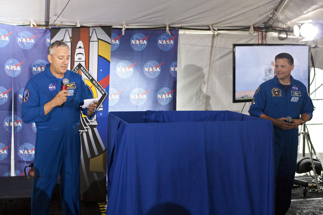 CAPE CANAVERAL, Fla. -- At Kennedy Space Center in Florida, NASA is hosting a Tweetup for 150 Twitter followers of space shuttle Atlantis' STS-135 mission to the International Space Station, selected from more than 5,500 online registrants. A Tweetup is an informal meeting of people who use the social messaging medium Twitter. Here, NASA astronauts Mike Massimino (left) and Doug Wheelock introduce a special guest to the Tweetup.            Atlantis and its crew of four; Commander Chris Ferguson, Pilot Doug Hurley, Mission Specialists Sandy Magnus and Rex Walheim, are scheduled to lift off at 11:26 a.m. EDT on July 8 to deliver the Raffaello multi-purpose logistics module packed with supplies and spare parts to the station. Atlantis also will fly the Robotic Refueling Mission experiment that will investigate the potential for robotically refueling existing satellites in orbit. In addition, Atlantis will return with a failed ammonia pump module to help NASA better understand the failure mechanism and improve pump designs for future systems. STS-135 will be the 33rd flight of Atlantis, the 37th shuttle mission to the space station, and the 135th and final mission of NASA's Space Shuttle Program. For more information visit, www.nasa.gov/mission_pages/shuttle/shuttlemissions/sts135/index.html. Photo credit: NASA/Troy Cryder