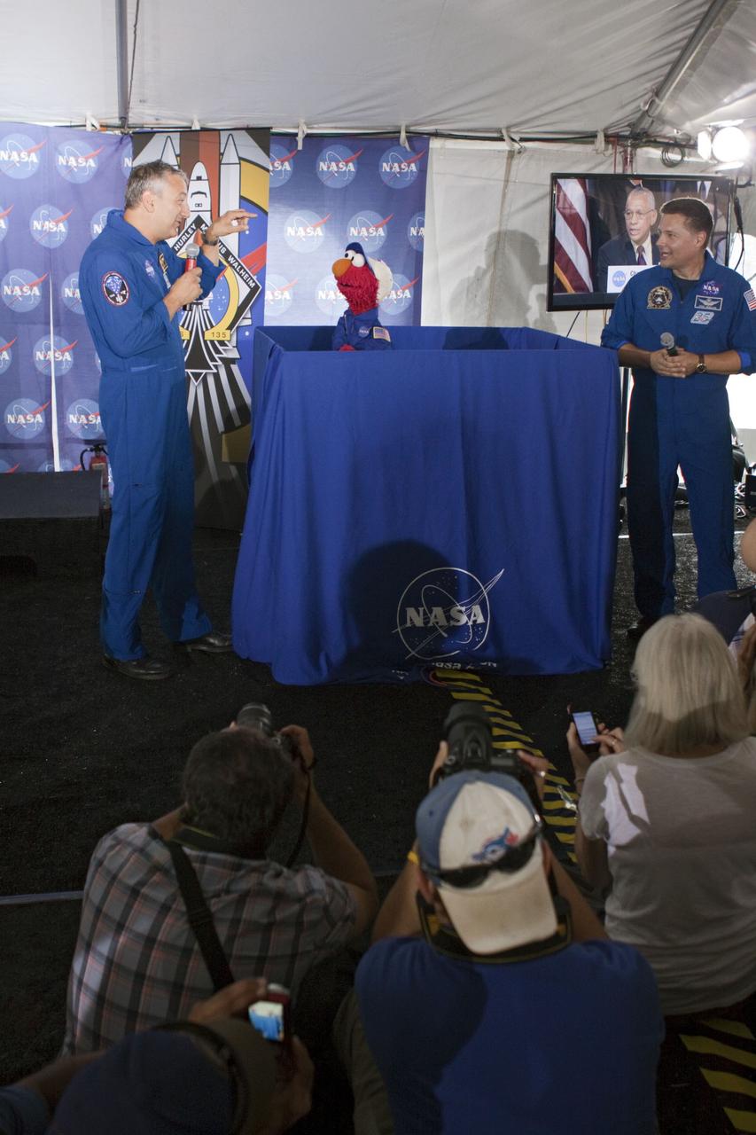 CAPE CANAVERAL, Fla. -- At Kennedy Space Center in Florida, NASA is hosting a Tweetup for 150 Twitter followers of space shuttle Atlantis' STS-135 mission to the International Space Station, selected from more than 5,500 online registrants. A Tweetup is an informal meeting of people who use the social messaging medium Twitter. Here, NASA astronauts Mike Massimino and Doug Wheelock talk with Sesame Street's Elmo. Sesame Street also is at Kennedy to film Elmo, as he learns about space exploration at NASA.              Atlantis and its crew of four; Commander Chris Ferguson, Pilot Doug Hurley, Mission Specialists Sandy Magnus and Rex Walheim, are scheduled to lift off at 11:26 a.m. EDT on July 8 to deliver the Raffaello multi-purpose logistics module packed with supplies and spare parts to the station. Atlantis also will fly the Robotic Refueling Mission experiment that will investigate the potential for robotically refueling existing satellites in orbit. In addition, Atlantis will return with a failed ammonia pump module to help NASA better understand the failure mechanism and improve pump designs for future systems. STS-135 will be the 33rd flight of Atlantis, the 37th shuttle mission to the space station, and the 135th and final mission of NASA's Space Shuttle Program. For more information visit, www.nasa.gov/mission_pages/shuttle/shuttlemissions/sts135/index.html. Photo credit: NASA/Troy Cryder
