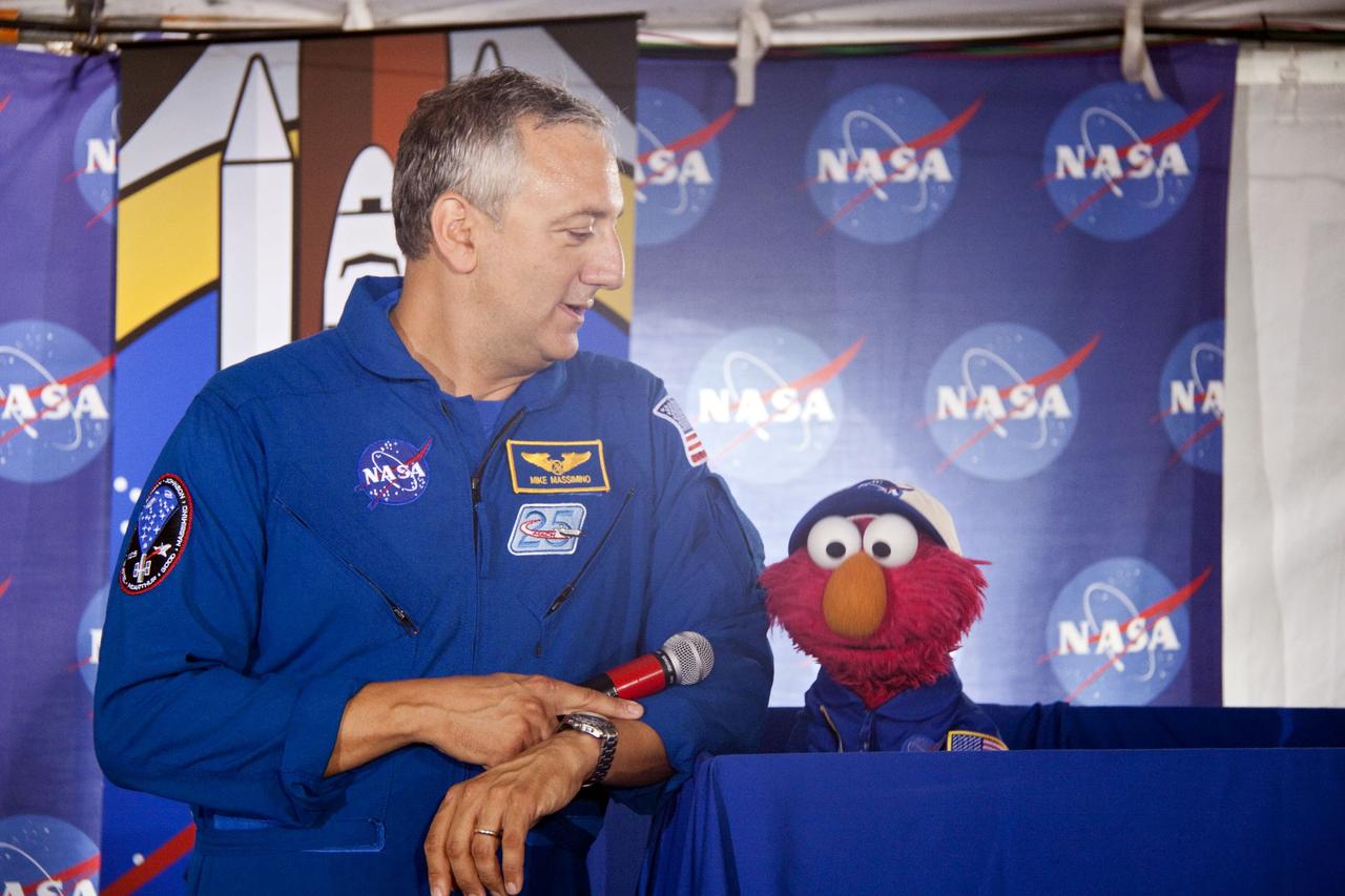 CAPE CANAVERAL, Fla. -- At Kennedy Space Center in Florida, NASA is hosting a Tweetup for 150 Twitter followers of space shuttle Atlantis' STS-135 mission to the International Space Station, selected from more than 5,500 online registrants. A Tweetup is an informal meeting of people who use the social messaging medium Twitter. Here, NASA astronaut Mike Massimino talks with Sesame Street's Elmo. Sesame Street also is at Kennedy to film Elmo, as he learns about space exploration at NASA.            Atlantis and its crew of four; Commander Chris Ferguson, Pilot Doug Hurley, Mission Specialists Sandy Magnus and Rex Walheim, are scheduled to lift off at 11:26 a.m. EDT on July 8 to deliver the Raffaello multi-purpose logistics module packed with supplies and spare parts to the station. Atlantis also will fly the Robotic Refueling Mission experiment that will investigate the potential for robotically refueling existing satellites in orbit. In addition, Atlantis will return with a failed ammonia pump module to help NASA better understand the failure mechanism and improve pump designs for future systems. STS-135 will be the 33rd flight of Atlantis, the 37th shuttle mission to the space station, and the 135th and final mission of NASA's Space Shuttle Program. For more information visit, www.nasa.gov/mission_pages/shuttle/shuttlemissions/sts135/index.html. Photo credit: NASA/Troy Cryder