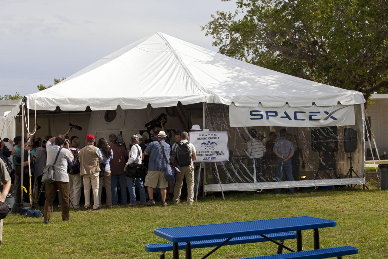 CAPE CANAVERAL, Fla. -- Space Exploration Technologies Corp., or SpaceX, displays a mock-up of its Dragon capsule during a media tour at Cape Canaveral Air Force Station, or CCAFS, in Florida.    In December 2010, SpaceX launched its Falcon 9 rocket and Dragon spacecraft from CCAFS's Launch Complex 40. The Dragon capsule went through several maneuvers before it re-entered the atmosphere and splashed down in the Pacific Ocean about 500 miles west of the coast of Mexico. That was the first demonstration flight for NASA's Commercial Orbital Transportation Services (COTS) program, which will provide cargo flights to the International Space Station in the future. The company is preparing for another launch in late 2011, in which the Dragon spacecraft and trunk will fly close to the space station so the station’s robotic arm can grab the spacecraft and bring it in for a docking.  Photo credit: NASA/Frankie Martin