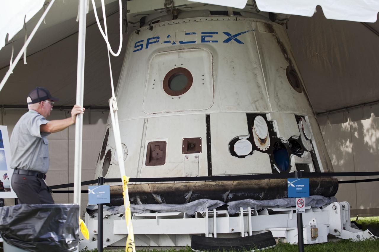 CAPE CANAVERAL, Fla. -- Space Exploration Technologies Corp., or SpaceX, displays a mock-up of its Dragon capsule during a media tour at Cape Canaveral Air Force Station, or CCAFS, in Florida.    In December 2010, SpaceX launched its Falcon 9 rocket and Dragon spacecraft from CCAFS's Launch Complex 40. The Dragon capsule went through several maneuvers before it re-entered the atmosphere and splashed down in the Pacific Ocean about 500 miles west of the coast of Mexico. That was the first demonstration flight for NASA's Commercial Orbital Transportation Services (COTS) program, which will provide cargo flights to the International Space Station in the future. The company is preparing for another launch in late 2011, in which the Dragon spacecraft and trunk will fly close to the space station so the station’s robotic arm can grab the spacecraft and bring it in for a docking.  Photo credit: NASA/Frankie Martin