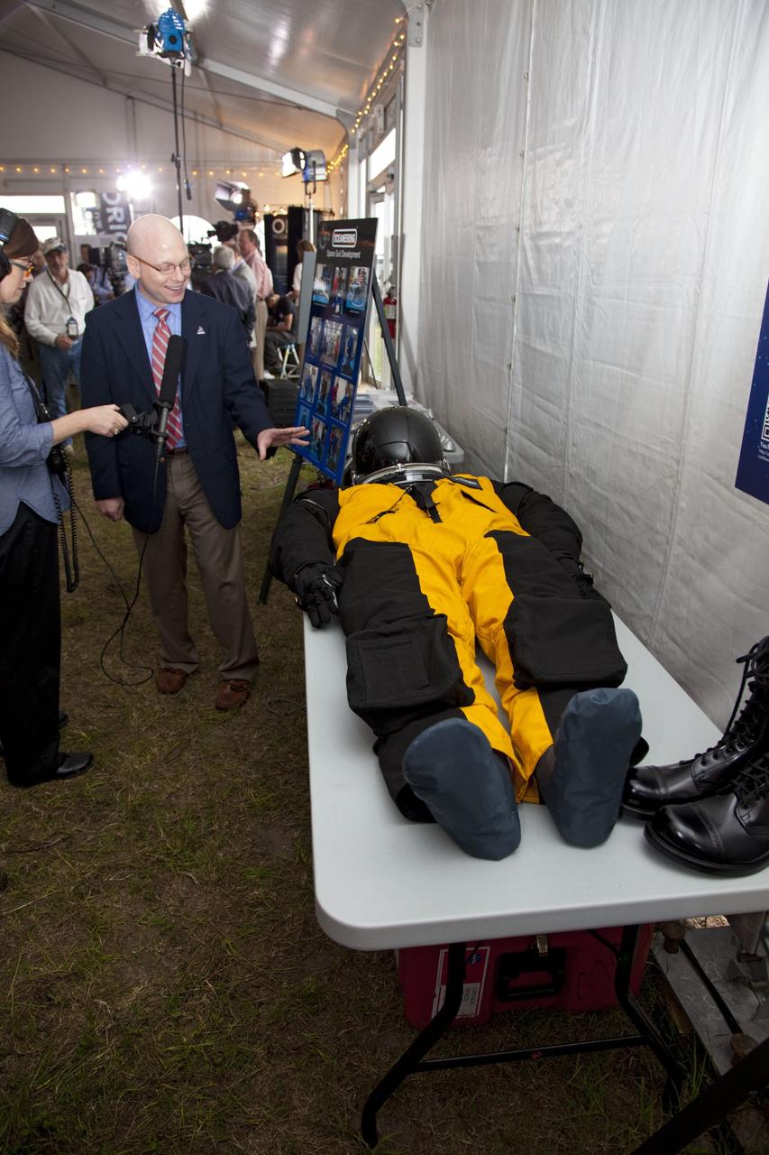 CAPE CANAVERAL, Fla. -- A media event was held on the grounds near the Press Site at NASA's Kennedy Space Center in Florida where a Multi-Purpose Crew Vehicle (MPCV) is on display. The MPCV is based on the Orion design requirements for traveling beyond low Earth orbit and will serve as the exploration vehicle that will carry the crew to space, provide emergency abort capability, sustain the crew during the space travel, and provide safe re-entry from deep space return velocities. Seen here is a sample of the Orion launch-and-entry suit on display. Photo credit: NASA/Frankie Martin