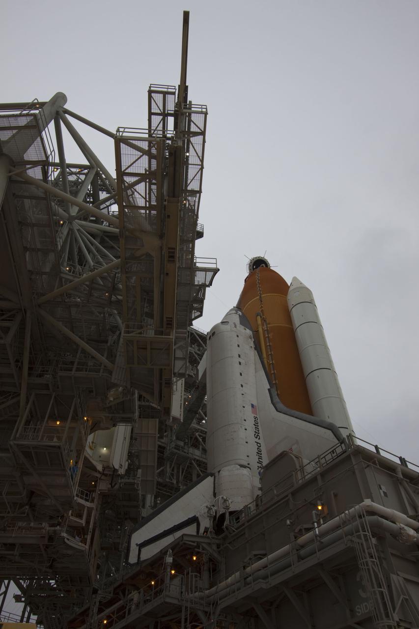 CAPE CANAVERAL, Fla. -- On a cloudy and overcast day on Launch Pad 39A at NASA's Kennedy Space Center in Florida, the rotating service structure (RSS) slowly rolls away revealing space shuttle Atlantis. The RSS provides weather protection and access to the shuttle while it awaits liftoff. RSS "rollback" marks a major milestone in Atlantis' STS-135 mission countdown.        Atlantis and its crew of four; Commander Chris Ferguson, Pilot Doug Hurley and Mission Specialists Sandy Magnus and Rex Walheim, are scheduled to lift off at 11:26 a.m. EDT on July 8 to deliver the Raffaello multi-purpose logistics module packed with supplies and spare parts to the International Space Station. Atlantis also will fly the Robotic Refueling Mission experiment that will investigate the potential for robotically refueling existing satellites in orbit. In addition, Atlantis will return with a failed ammonia pump module to help NASA better understand the failure mechanism and improve pump designs for future systems. STS-135 will be the 33rd flight of Atlantis, the 37th shuttle mission to the space station, and the 135th and final mission of NASA's Space Shuttle Program. For more information visit, www.nasa.gov/mission_pages/shuttle/shuttlemissions/sts135/index.html. Photo credit: NASA/Troy Cryder