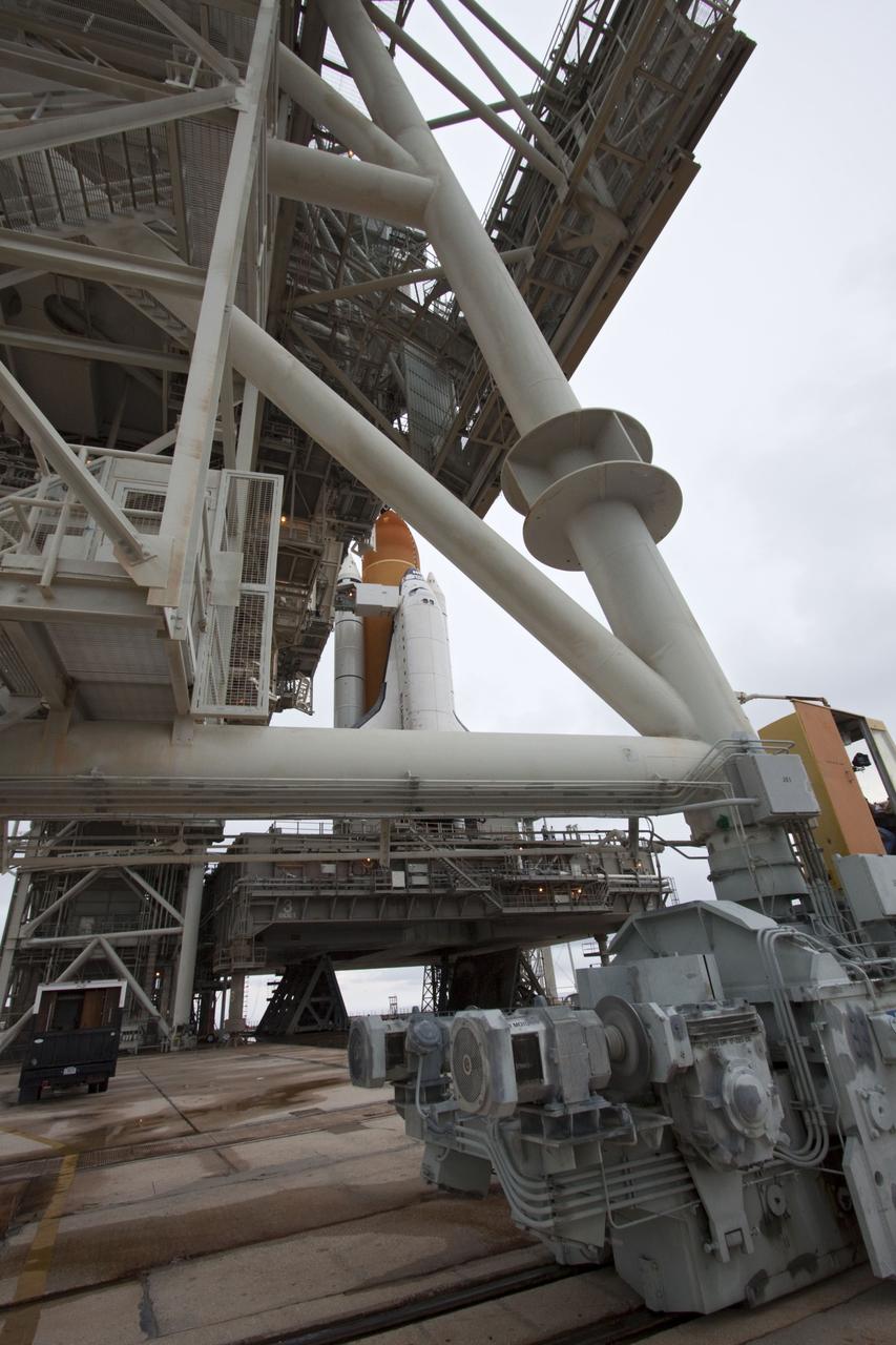 CAPE CANAVERAL, Fla. -- Space shuttle Atlantis is revealed on Launch Pad 39A at NASA's Kennedy Space Center in Florida following the move of the rotating service structure (RSS). The structure provides weather protection and access to the shuttle while it awaits liftoff on the pad. RSS "rollback" marks a major milestone in Atlantis' STS-135 mission countdown.    Atlantis and its crew of four; Commander Chris Ferguson, Pilot Doug Hurley and Mission Specialists Sandy Magnus and Rex Walheim, are scheduled to lift off at 11:26 a.m. EDT on July 8 to deliver the Raffaello multi-purpose logistics module packed with supplies and spare parts to the International Space Station. Atlantis also will fly the Robotic Refueling Mission experiment that will investigate the potential for robotically refueling existing satellites in orbit. In addition, Atlantis will return with a failed ammonia pump module to help NASA better understand the failure mechanism and improve pump designs for future systems. STS-135 will be the 33rd flight of Atlantis, the 37th shuttle mission to the space station, and the 135th and final mission of NASA's Space Shuttle Program. For more information visit, www.nasa.gov/mission_pages/shuttle/shuttlemissions/sts135/index.html. Photo credit: NASA/Troy Cryder