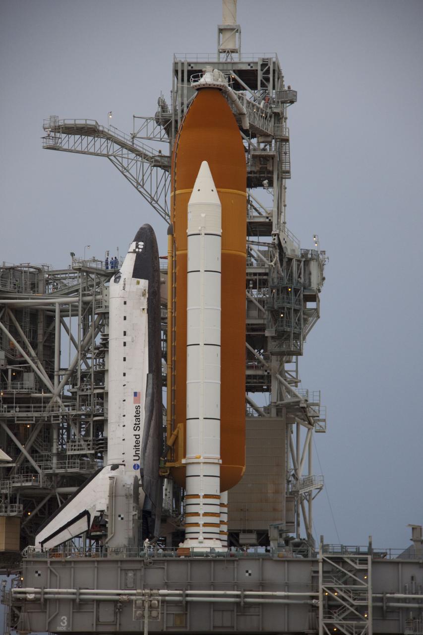 CAPE CANAVERAL, Fla. -- Space shuttle Atlantis is revealed on Launch Pad 39A at NASA's Kennedy Space Center in Florida following the move of the rotating service structure (RSS). The structure provides weather protection and access to the shuttle while it awaits liftoff on the pad. RSS "rollback" marks a major milestone in Atlantis' STS-135 mission countdown. Atlantis and its crew of four; Commander Chris Ferguson, Pilot Doug Hurley and Mission Specialists Sandy Magnus and Rex Walheim, are scheduled to lift off at 11:26 a.m. EDT on July 8 to deliver the Raffaello multi-purpose logistics module packed with supplies and spare parts to the International Space Station. Atlantis also will fly the Robotic Refueling Mission experiment that will investigate the potential for robotically refueling existing satellites in orbit. In addition, Atlantis will return with a failed ammonia pump module to help NASA better understand the failure mechanism and improve pump designs for future systems. STS-135 will be the 33rd flight of Atlantis, the 37th shuttle mission to the space station, and the 135th and final mission of NASA's Space Shuttle Program. For more information visit, www.nasa.gov/mission_pages/shuttle/shuttlemissions/sts135/index.html. Photo credit: NASA/Troy Cryder
