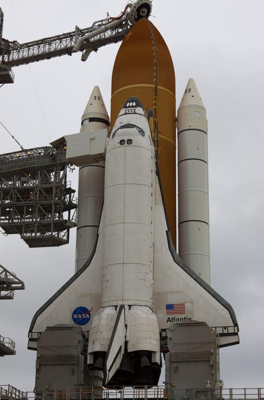 CAPE CANAVERAL, Fla. -- Space shuttle Atlantis is revealed on Launch Pad 39A at NASA's Kennedy Space Center in Florida following the move of the rotating service structure (RSS). The structure provides weather protection and access to the shuttle while it awaits liftoff on the pad. RSS "rollback" marks a major milestone in Atlantis' STS-135 mission countdown.      Atlantis and its crew of four; Commander Chris Ferguson, Pilot Doug Hurley and Mission Specialists Sandy Magnus and Rex Walheim, are scheduled to lift off at 11:26 a.m. EDT on July 8 to deliver the Raffaello multi-purpose logistics module packed with supplies and spare parts to the International Space Station. Atlantis also will fly the Robotic Refueling Mission experiment that will investigate the potential for robotically refueling existing satellites in orbit. In addition, Atlantis will return with a failed ammonia pump module to help NASA better understand the failure mechanism and improve pump designs for future systems. STS-135 will be the 33rd flight of Atlantis, the 37th shuttle mission to the space station, and the 135th and final mission of NASA's Space Shuttle Program. For more information visit, www.nasa.gov/mission_pages/shuttle/shuttlemissions/sts135/index.html. Photo credit: NASA/Troy Cryder