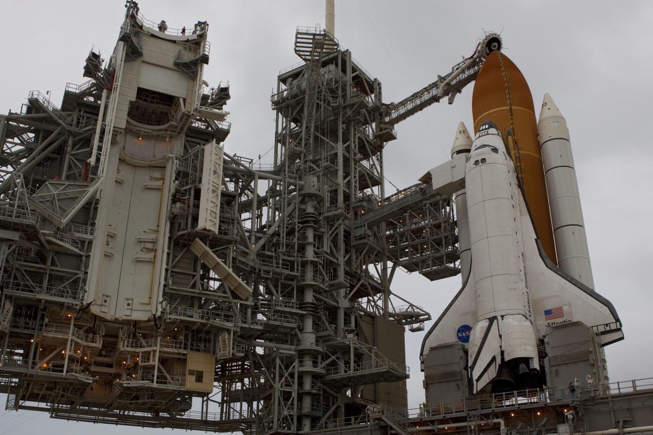 CAPE CANAVERAL, Fla. -- Space shuttle Atlantis is revealed on Launch Pad 39A at NASA's Kennedy Space Center in Florida following the move of the rotating service structure (RSS). The structure provides weather protection and access to the shuttle while it awaits liftoff on the pad. RSS "rollback" marks a major milestone in Atlantis' STS-135 mission countdown.      Atlantis and its crew of four; Commander Chris Ferguson, Pilot Doug Hurley and Mission Specialists Sandy Magnus and Rex Walheim, are scheduled to lift off at 11:26 a.m. EDT on July 8 to deliver the Raffaello multi-purpose logistics module packed with supplies and spare parts to the International Space Station. Atlantis also will fly the Robotic Refueling Mission experiment that will investigate the potential for robotically refueling existing satellites in orbit. In addition, Atlantis will return with a failed ammonia pump module to help NASA better understand the failure mechanism and improve pump designs for future systems. STS-135 will be the 33rd flight of Atlantis, the 37th shuttle mission to the space station, and the 135th and final mission of NASA's Space Shuttle Program. For more information visit, www.nasa.gov/mission_pages/shuttle/shuttlemissions/sts135/index.html. Photo credit: NASA/Troy Cryder