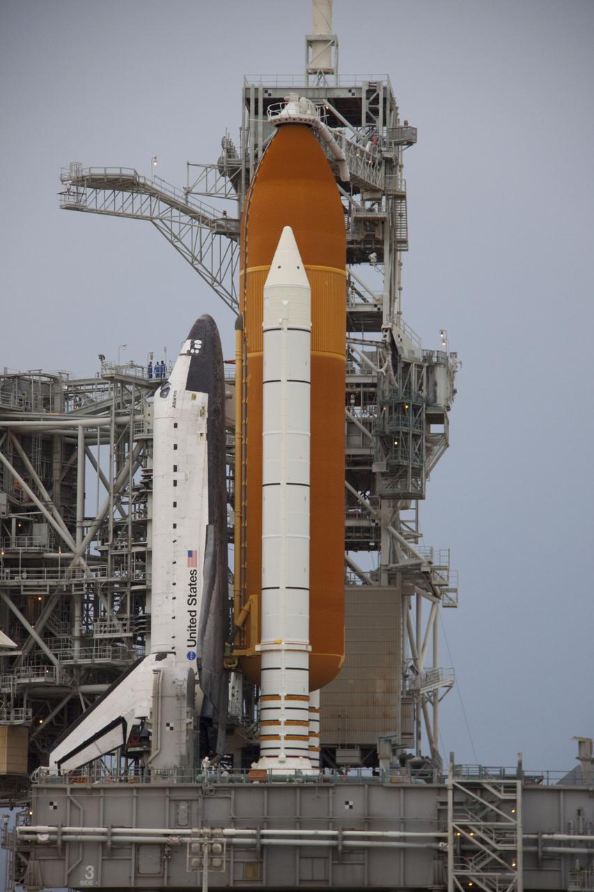CAPE CANAVERAL, Fla. -- Space shuttle Atlantis is revealed on Launch Pad 39A at NASA's Kennedy Space Center in Florida following the move of the rotating service structure (RSS). The structure provides weather protection and access to the shuttle while it awaits liftoff on the pad. RSS "rollback" marks a major milestone in Atlantis' STS-135 mission countdown.            Atlantis and its crew of four; Commander Chris Ferguson, Pilot Doug Hurley and Mission Specialists Sandy Magnus and Rex Walheim, are scheduled to lift off at 11:26 a.m. EDT on July 8 to deliver the Raffaello multi-purpose logistics module packed with supplies and spare parts to the International Space Station. Atlantis also will fly the Robotic Refueling Mission experiment that will investigate the potential for robotically refueling existing satellites in orbit. In addition, Atlantis will return with a failed ammonia pump module to help NASA better understand the failure mechanism and improve pump designs for future systems. STS-135 will be the 33rd flight of Atlantis, the 37th shuttle mission to the space station, and the 135th and final mission of NASA's Space Shuttle Program. For more information visit, www.nasa.gov/mission_pages/shuttle/shuttlemissions/sts135/index.html. Photo credit: NASA/Troy Cryder