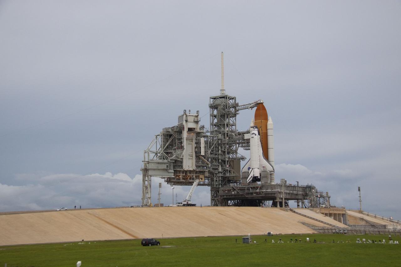 CAPE CANAVERAL, Fla. -- Space shuttle Atlantis is revealed on Launch Pad 39A at NASA's Kennedy Space Center in Florida following the move of the rotating service structure (RSS). The structure provides weather protection and access to the shuttle while it awaits liftoff on the pad. RSS "rollback" marks a major milestone in Atlantis' STS-135 mission countdown.            Atlantis and its crew of four; Commander Chris Ferguson, Pilot Doug Hurley and Mission Specialists Sandy Magnus and Rex Walheim, are scheduled to lift off at 11:26 a.m. EDT on July 8 to deliver the Raffaello multi-purpose logistics module packed with supplies and spare parts to the International Space Station. Atlantis also will fly the Robotic Refueling Mission experiment that will investigate the potential for robotically refueling existing satellites in orbit. In addition, Atlantis will return with a failed ammonia pump module to help NASA better understand the failure mechanism and improve pump designs for future systems. STS-135 will be the 33rd flight of Atlantis, the 37th shuttle mission to the space station, and the 135th and final mission of NASA's Space Shuttle Program. For more information visit, www.nasa.gov/mission_pages/shuttle/shuttlemissions/sts135/index.html. Photo credit: NASA/Troy Cryder