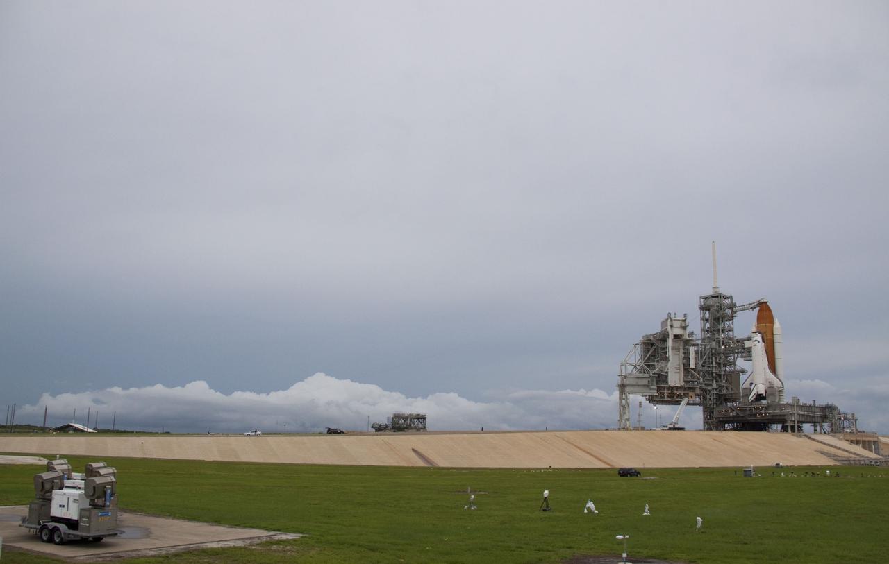 CAPE CANAVERAL, Fla. -- Space shuttle Atlantis is revealed on Launch Pad 39A at NASA's Kennedy Space Center in Florida following the move of the rotating service structure (RSS). The structure provides weather protection and access to the shuttle while it awaits liftoff on the pad. RSS "rollback" marks a major milestone in Atlantis' STS-135 mission countdown.            Atlantis and its crew of four; Commander Chris Ferguson, Pilot Doug Hurley and Mission Specialists Sandy Magnus and Rex Walheim, are scheduled to lift off at 11:26 a.m. EDT on July 8 to deliver the Raffaello multi-purpose logistics module packed with supplies and spare parts to the International Space Station. Atlantis also will fly the Robotic Refueling Mission experiment that will investigate the potential for robotically refueling existing satellites in orbit. In addition, Atlantis will return with a failed ammonia pump module to help NASA better understand the failure mechanism and improve pump designs for future systems. STS-135 will be the 33rd flight of Atlantis, the 37th shuttle mission to the space station, and the 135th and final mission of NASA's Space Shuttle Program. For more information visit, www.nasa.gov/mission_pages/shuttle/shuttlemissions/sts135/index.html. Photo credit: NASA/Troy Cryder