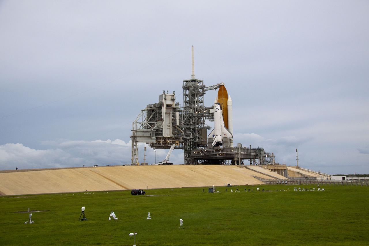 CAPE CANAVERAL, Fla. -- Space shuttle Atlantis is revealed on Launch Pad 39A at NASA's Kennedy Space Center in Florida following the move of the rotating service structure (RSS). The structure provides weather protection and access to the shuttle while it awaits liftoff on the pad. RSS "rollback" marks a major milestone in Atlantis' STS-135 mission countdown.            Atlantis and its crew of four; Commander Chris Ferguson, Pilot Doug Hurley and Mission Specialists Sandy Magnus and Rex Walheim, are scheduled to lift off at 11:26 a.m. EDT on July 8 to deliver the Raffaello multi-purpose logistics module packed with supplies and spare parts to the International Space Station. Atlantis also will fly the Robotic Refueling Mission experiment that will investigate the potential for robotically refueling existing satellites in orbit. In addition, Atlantis will return with a failed ammonia pump module to help NASA better understand the failure mechanism and improve pump designs for future systems. STS-135 will be the 33rd flight of Atlantis, the 37th shuttle mission to the space station, and the 135th and final mission of NASA's Space Shuttle Program. For more information visit, www.nasa.gov/mission_pages/shuttle/shuttlemissions/sts135/index.html. Photo credit: NASA/Troy Cryder