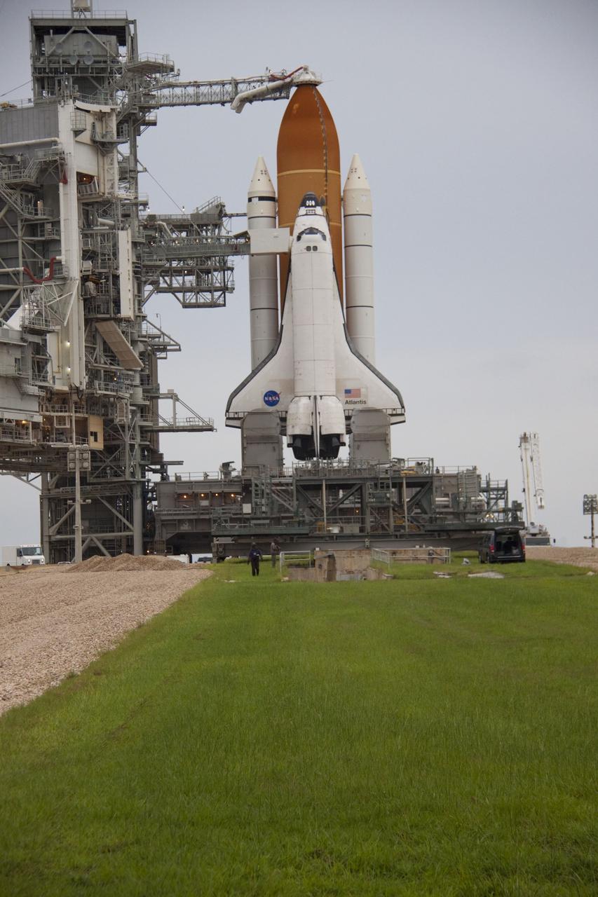 CAPE CANAVERAL, Fla. -- Space shuttle Atlantis is revealed on Launch Pad 39A at NASA's Kennedy Space Center in Florida following the move of the rotating service structure (RSS). The structure provides weather protection and access to the shuttle while it awaits liftoff on the pad. RSS "rollback" marks a major milestone in Atlantis' STS-135 mission countdown.            Atlantis and its crew of four; Commander Chris Ferguson, Pilot Doug Hurley and Mission Specialists Sandy Magnus and Rex Walheim, are scheduled to lift off at 11:26 a.m. EDT on July 8 to deliver the Raffaello multi-purpose logistics module packed with supplies and spare parts to the International Space Station. Atlantis also will fly the Robotic Refueling Mission experiment that will investigate the potential for robotically refueling existing satellites in orbit. In addition, Atlantis will return with a failed ammonia pump module to help NASA better understand the failure mechanism and improve pump designs for future systems. STS-135 will be the 33rd flight of Atlantis, the 37th shuttle mission to the space station, and the 135th and final mission of NASA's Space Shuttle Program. For more information visit, www.nasa.gov/mission_pages/shuttle/shuttlemissions/sts135/index.html. Photo credit: NASA/Troy Cryder