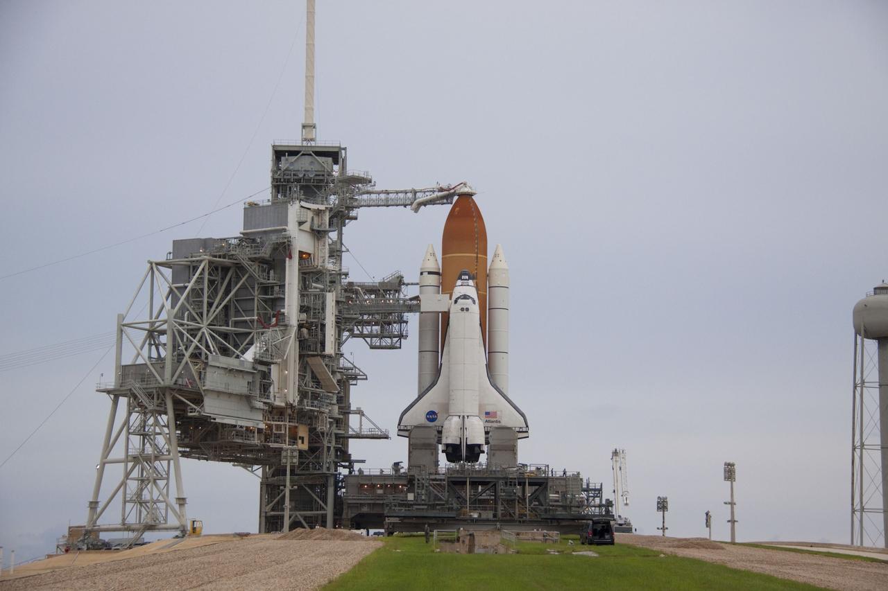 CAPE CANAVERAL, Fla. -- Space shuttle Atlantis is revealed on Launch Pad 39A at NASA's Kennedy Space Center in Florida following the move of the rotating service structure (RSS). The structure provides weather protection and access to the shuttle while it awaits liftoff on the pad. RSS "rollback" marks a major milestone in Atlantis' STS-135 mission countdown.            Atlantis and its crew of four; Commander Chris Ferguson, Pilot Doug Hurley and Mission Specialists Sandy Magnus and Rex Walheim, are scheduled to lift off at 11:26 a.m. EDT on July 8 to deliver the Raffaello multi-purpose logistics module packed with supplies and spare parts to the International Space Station. Atlantis also will fly the Robotic Refueling Mission experiment that will investigate the potential for robotically refueling existing satellites in orbit. In addition, Atlantis will return with a failed ammonia pump module to help NASA better understand the failure mechanism and improve pump designs for future systems. STS-135 will be the 33rd flight of Atlantis, the 37th shuttle mission to the space station, and the 135th and final mission of NASA's Space Shuttle Program. For more information visit, www.nasa.gov/mission_pages/shuttle/shuttlemissions/sts135/index.html. Photo credit: NASA/Troy Cryder