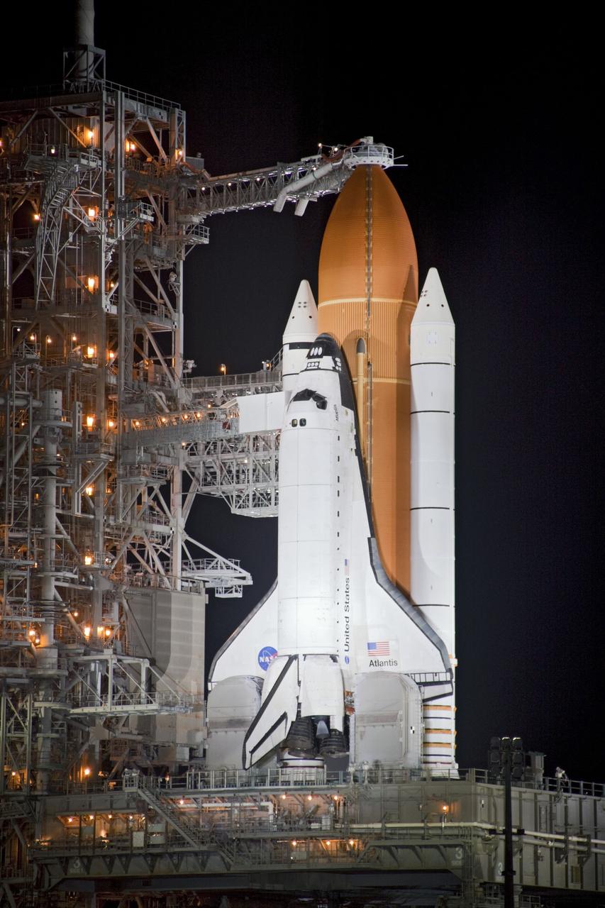 CAPE CANAVERAL, Fla. -- Space shuttle Atlantis is revealed on Launch Pad 39A at NASA's Kennedy Space Center in Florida following the move of the rotating service structure (RSS). The structure provides weather protection and access to the shuttle while it awaits liftoff on the pad. RSS retract marks a major milestone in Atlantis' STS-135 mission countdown.          Atlantis and its crew of four; Commander Chris Ferguson, Pilot Doug Hurley, Mission Specialists Sandy Magnus and Rex Walheim will lift off at 11:26 a.m. EDT on July 8 to deliver the Raffaello multi-purpose logistics module packed with supplies and spare parts for the International Space Station. Atlantis also will fly the Robotic Refueling Mission experiment that will investigate the potential for robotically refueling existing satellites in orbit. In addition, Atlantis will return with a failed ammonia pump module to help NASA better understand the failure mechanism and improve pump designs for future systems. STS-135 is the 33rd flight of Atlantis, the 37th shuttle mission to the space station, and the 135th and final mission of NASA's Space Shuttle Program. For more information, visit www.nasa.gov/mission_pages/shuttle/shuttlemissions/sts135/index.html. Photo credit: Jim Grossmann