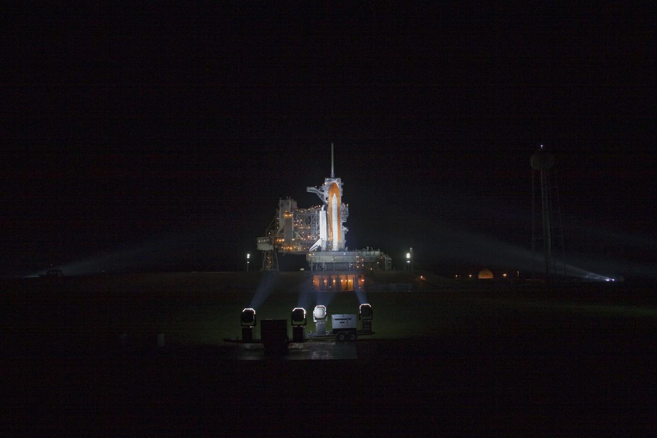 CAPE CANAVERAL, Fla. -- Space shuttle Atlantis is revealed on Launch Pad 39A at NASA's Kennedy Space Center in Florida following the move of the rotating service structure (RSS). The structure provides weather protection and access to the shuttle while it awaits liftoff on the pad. RSS retract marks a major milestone in Atlantis' STS-135 mission countdown.          Atlantis and its crew of four; Commander Chris Ferguson, Pilot Doug Hurley, Mission Specialists Sandy Magnus and Rex Walheim will lift off at 11:26 a.m. EDT on July 8 to deliver the Raffaello multi-purpose logistics module packed with supplies and spare parts for the International Space Station. Atlantis also will fly the Robotic Refueling Mission experiment that will investigate the potential for robotically refueling existing satellites in orbit. In addition, Atlantis will return with a failed ammonia pump module to help NASA better understand the failure mechanism and improve pump designs for future systems. STS-135 is the 33rd flight of Atlantis, the 37th shuttle mission to the space station, and the 135th and final mission of NASA's Space Shuttle Program. For more information, visit www.nasa.gov/mission_pages/shuttle/shuttlemissions/sts135/index.html. Photo credit: Jim Grossmann