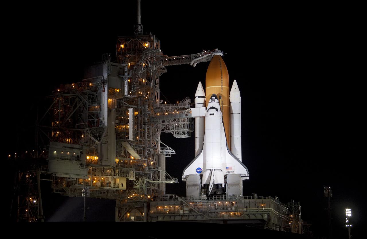 CAPE CANAVERAL, Fla. -- Space shuttle Atlantis is revealed on Launch Pad 39A at NASA's Kennedy Space Center in Florida following the move of the rotating service structure (RSS). The structure provides weather protection and access to the shuttle while it awaits liftoff on the pad. RSS retract marks a major milestone in Atlantis' STS-135 mission countdown.         Atlantis and its crew of four; Commander Chris Ferguson, Pilot Doug Hurley, Mission Specialists Sandy Magnus and Rex Walheim will lift off at 11:26 a.m. EDT on July 8 to deliver the Raffaello multi-purpose logistics module packed with supplies and spare parts for the International Space Station. Atlantis also will fly the Robotic Refueling Mission experiment that will investigate the potential for robotically refueling existing satellites in orbit. In addition, Atlantis will return with a failed ammonia pump module to help NASA better understand the failure mechanism and improve pump designs for future systems. STS-135 is the 33rd flight of Atlantis, the 37th shuttle mission to the space station, and the 135th and final mission of NASA's Space Shuttle Program. For more information, visit www.nasa.gov/mission_pages/shuttle/shuttlemissions/sts135/index.html. Photo credit: Jim Grossmann