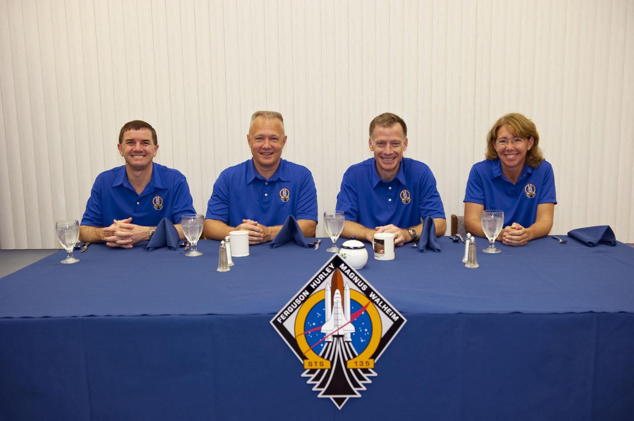 CAPE CANAVERAL, Fla. -- The final four astronauts to launch aboard a space shuttle await breakfast in their Astronaut Crew Quarters in the Operations and Checkout Building at NASA's Kennedy Space Center in Florida. From left, are STS-135 Mission Specialist Rex Walheim, Pilot Doug Hurley, Commander Chris Ferguson, and Mission Specialist Sandy Magnus. The astronauts are scheduled to lift off aboard space shuttle Atlantis at 11:26 a.m. EDT on July 8 for their mission to the International Space Station.    STS-135 will deliver the Raffaello multi-purpose logistics module packed with supplies and spare parts for the orbiting outpost. Atlantis also will fly the Robotic Refueling Mission experiment that will investigate the potential for robotically refueling existing satellites in orbit. In addition, Atlantis will return with a failed ammonia pump module to help NASA better understand the failure mechanism and improve pump designs for future systems. STS-135 will be the 33rd flight of Atlantis, the 37th shuttle mission to the space station, and the 135th and final mission of NASA's Space Shuttle Program. For more information visit, www.nasa.gov/mission_pages/shuttle/shuttlemissions/sts135/index.html. Photo credit: NASA/Kim Shiflett