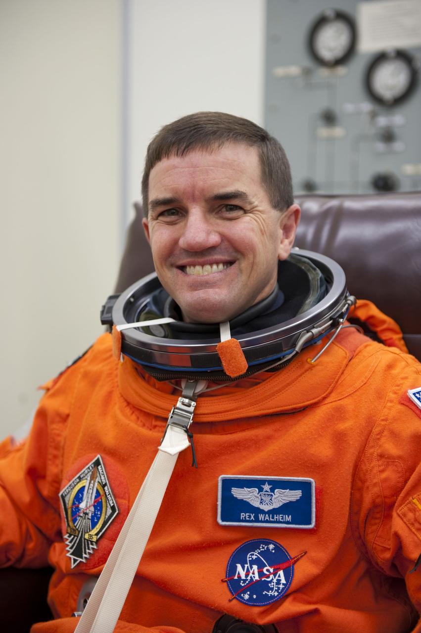 CAPE CANAVERAL, Fla. -- STS-135 Mission Specialist Rex Walheim dons his launch-and-entry suit in the Operations and Checkout Building at NASA's Kennedy Space Center in Florida. Walheim is one of the final four astronauts to launch aboard a space shuttle. All three of Walheim's missions -- STS-110, STS-122 and now STS-135 -- will have been aboard space shuttle Atlantis. STS-135 is scheduled to lift off aboard Atlantis at 11:26 a.m. EDT on July 8 for a mission to the International Space Station.      STS-135 will deliver the Raffaello multi-purpose logistics module packed with supplies and spare parts for the orbiting outpost. Atlantis also will fly the Robotic Refueling Mission experiment that will investigate the potential for robotically refueling existing satellites in orbit. In addition, Atlantis will return with a failed ammonia pump module to help NASA better understand the failure mechanism and improve pump designs for future systems. STS-135 will be the 33rd flight of Atlantis, the 37th shuttle mission to the space station, and the 135th and final mission of NASA's Space Shuttle Program. For more information visit, www.nasa.gov/mission_pages/shuttle/shuttlemissions/sts135/index.html. Photo credit: NASA/Kim Shiflett