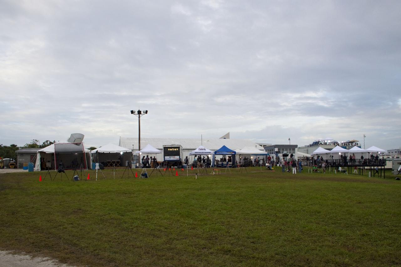 CAPE CANAVERAL, Fla. -- Media from around the globe gather on the grounds of the Press Site at NASA's Kennedy Space Center in Florida to photograph and cover the prelaunch activities and lift off of space shuttle Atlantis on its STS-135 mission to the International Space Station.             Atlantis began its final flight, with Commander Chris Ferguson, Pilot Doug Hurley and Mission Specialists Sandy Magnus and Rex Walheim on board, at 11:29 a.m. EDT July 8 to deliver the Raffaello multi-purpose logistics module packed with supplies and spare parts to the station. Also in Atlantis' payload bay is the Robotic Refueling Mission experiment that will investigate the potential for robotically refueling existing satellites in orbit. In addition, Atlantis will return with a failed ammonia pump module to help NASA better understand the failure mechanism and improve pump designs for future systems. STS-135 is the 33rd flight of Atlantis, the 37th shuttle mission to the space station, and the 135th and final mission of NASA's Space Shuttle Program. For more information, visit www.nasa.gov/mission_pages/shuttle/shuttlemissions/sts135/index.html. Photo credit: NASA/Jim Grossmann