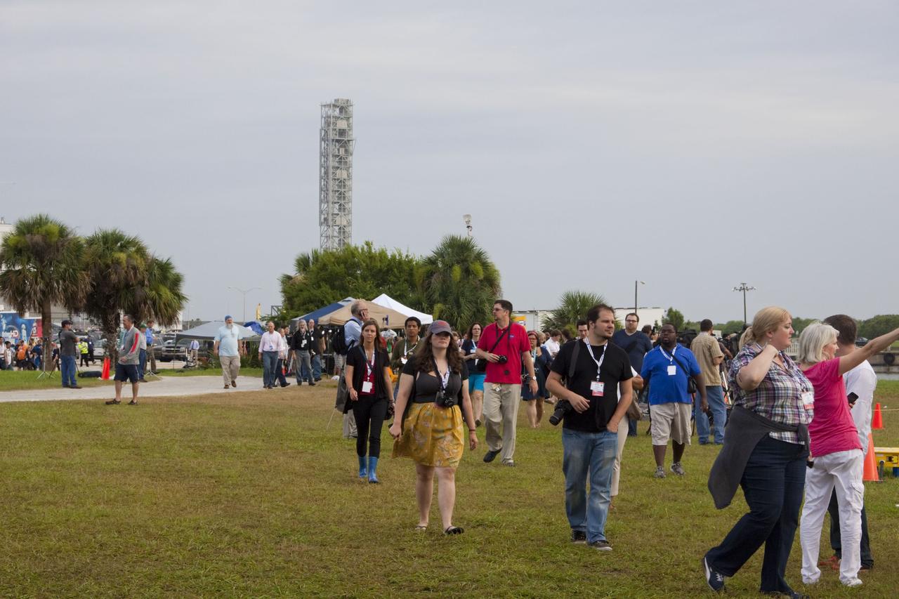 CAPE CANAVERAL, Fla. -- Media from around the globe gather on the grounds of the Press Site at NASA's Kennedy Space Center in Florida to photograph and cover the prelaunch activities and lift off of space shuttle Atlantis on its STS-135 mission to the International Space Station. Seen towering above is the massive Vehicle Assembly Building.            Atlantis began its final flight, with Commander Chris Ferguson, Pilot Doug Hurley and Mission Specialists Sandy Magnus and Rex Walheim on board, at 11:29 a.m. EDT July 8 to deliver the Raffaello multi-purpose logistics module packed with supplies and spare parts to the station. Also in Atlantis' payload bay is the Robotic Refueling Mission experiment that will investigate the potential for robotically refueling existing satellites in orbit. In addition, Atlantis will return with a failed ammonia pump module to help NASA better understand the failure mechanism and improve pump designs for future systems. STS-135 is the 33rd flight of Atlantis, the 37th shuttle mission to the space station, and the 135th and final mission of NASA's Space Shuttle Program. For more information, visit www.nasa.gov/mission_pages/shuttle/shuttlemissions/sts135/index.html. Photo credit: NASA/Jim Grossmann